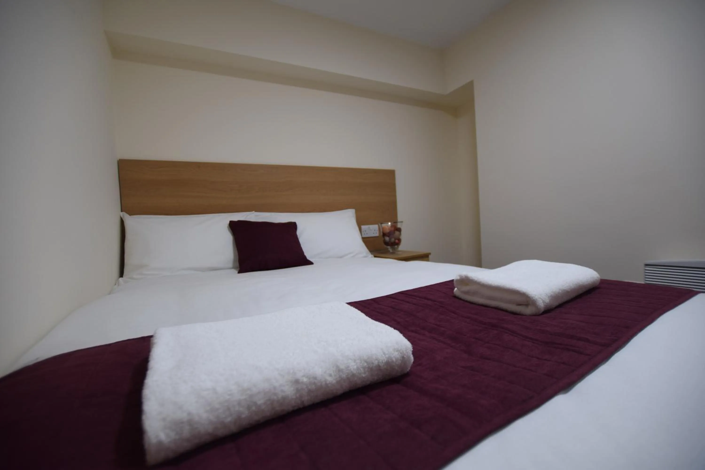 Bedroom, Bed in PremierLux Serviced Apartments