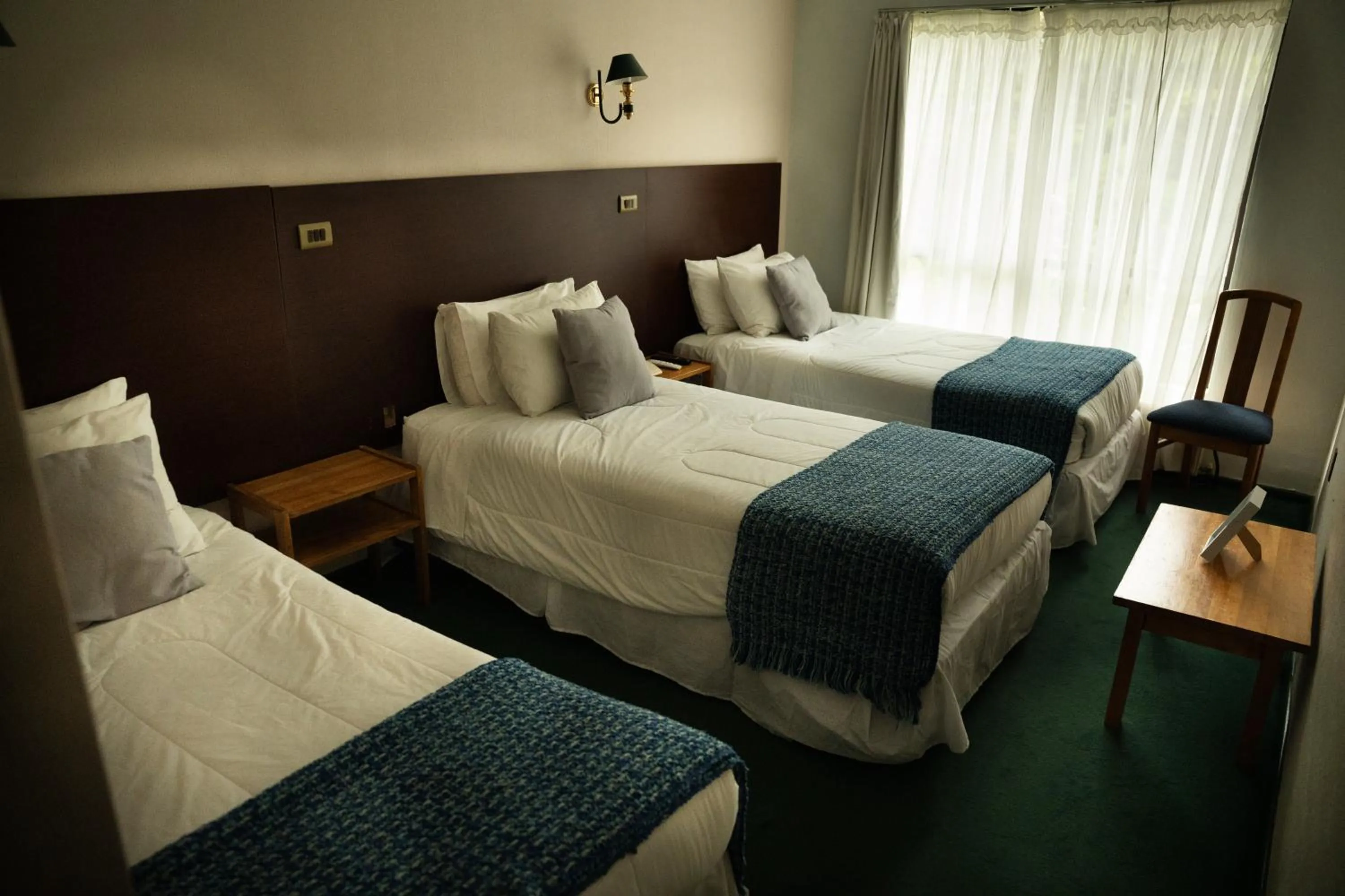 Bed in Hotel HD Natales