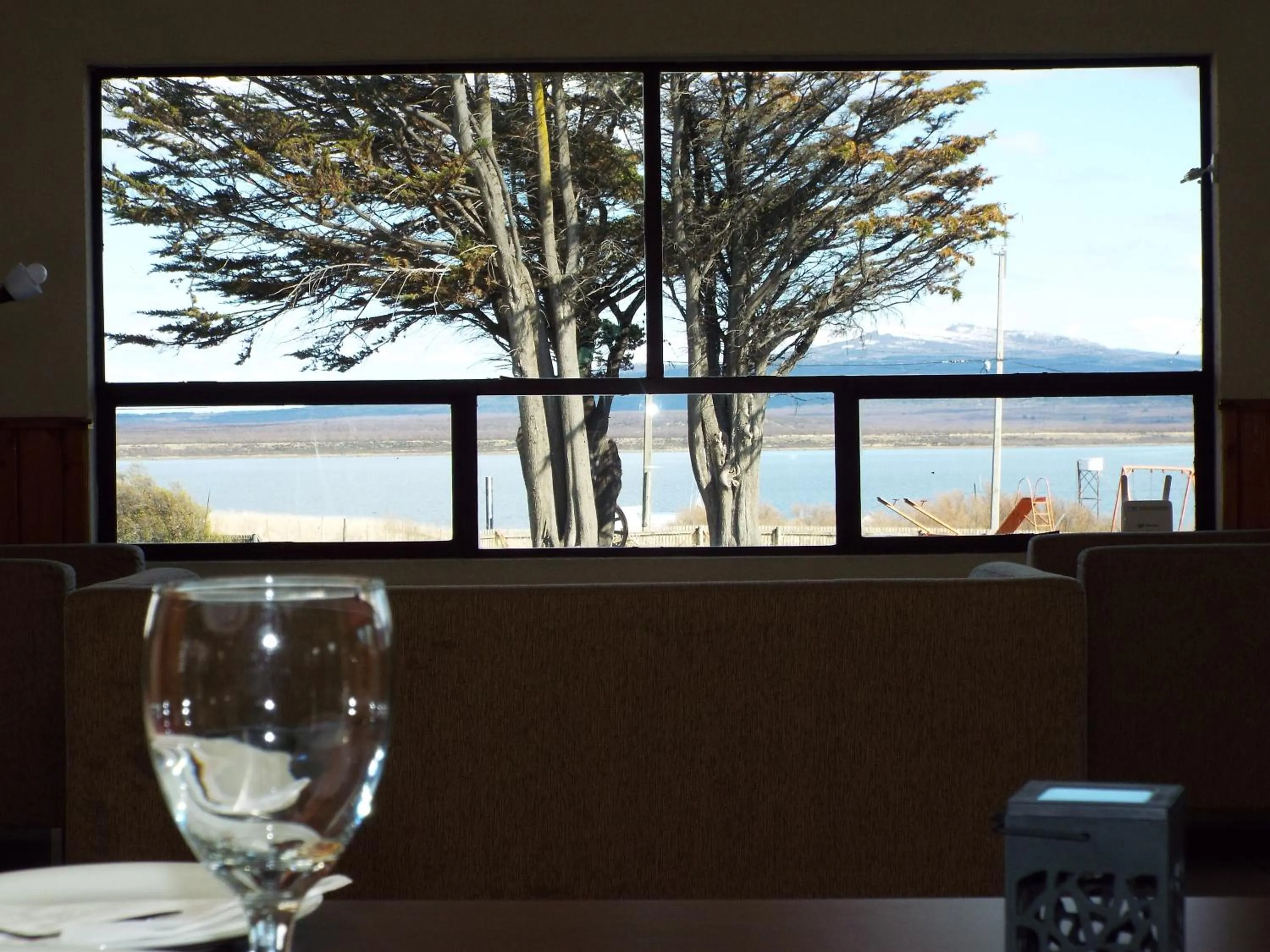 Communal lounge/ TV room in Hotel HD Natales