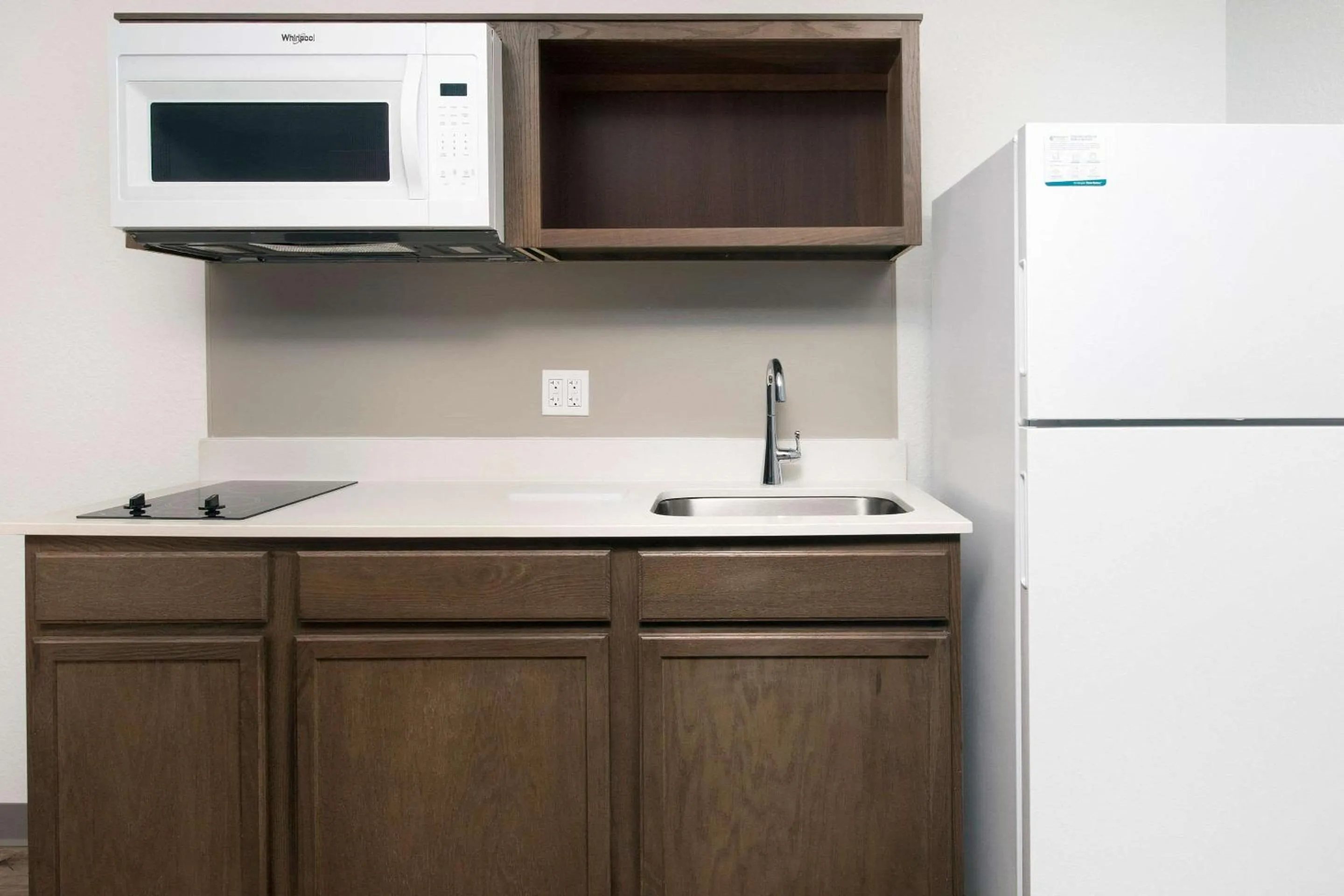 Kitchen or kitchenette in Woodspring Suites Orlando International Drive
