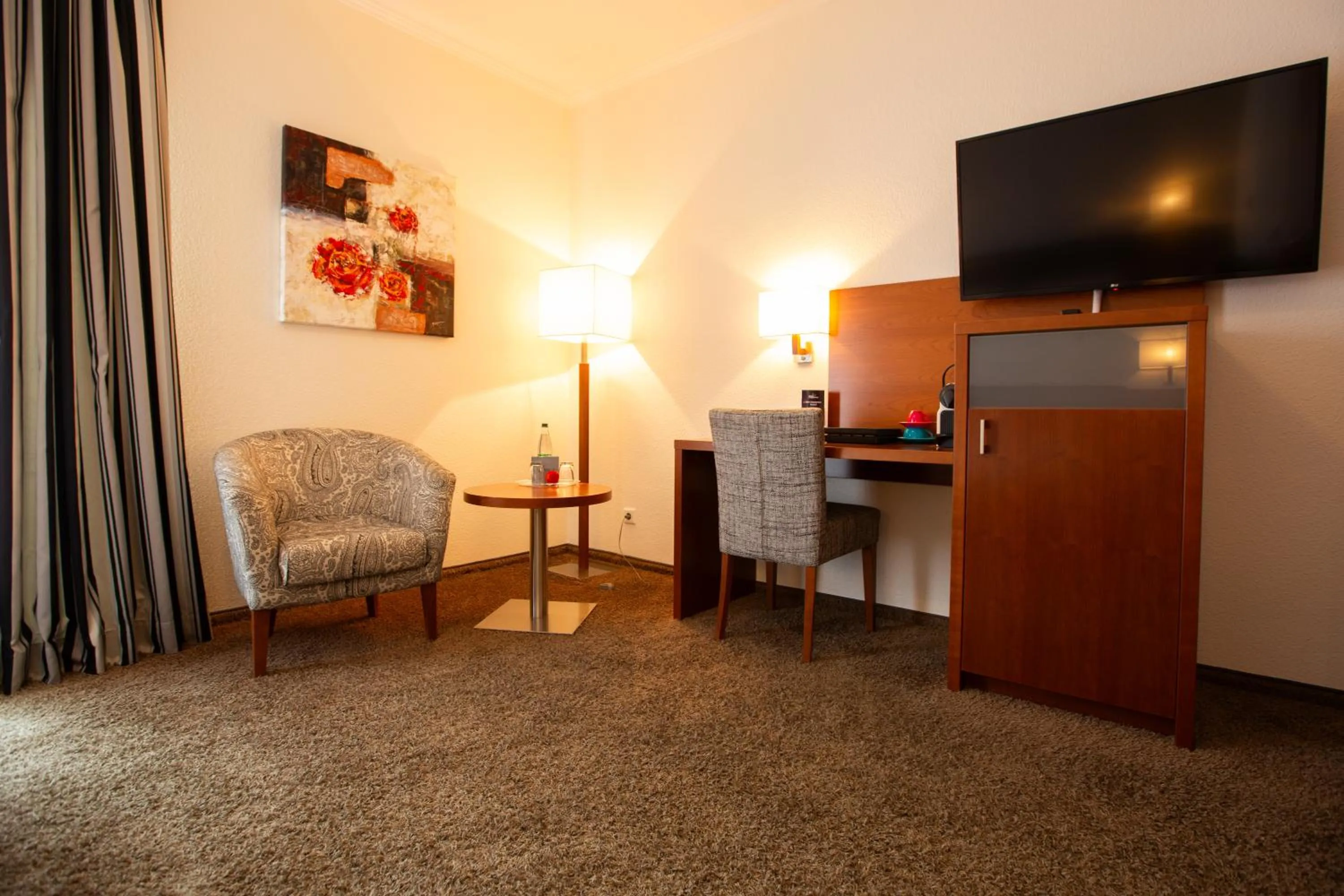 Communal lounge/ TV room in Ringhotel Appelbaum Gütersloh