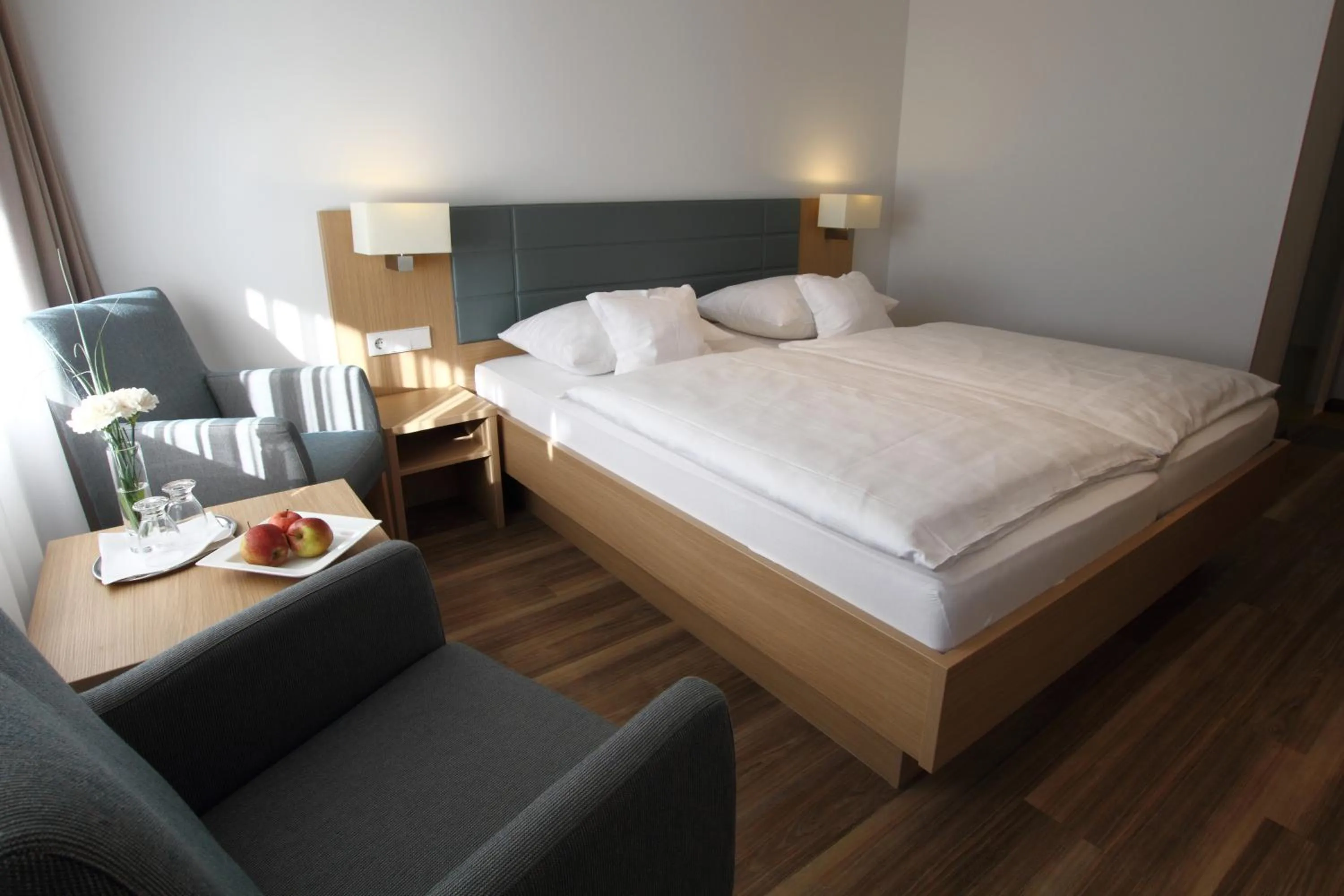 Seating area, Bed in Hotel Seepark Garni