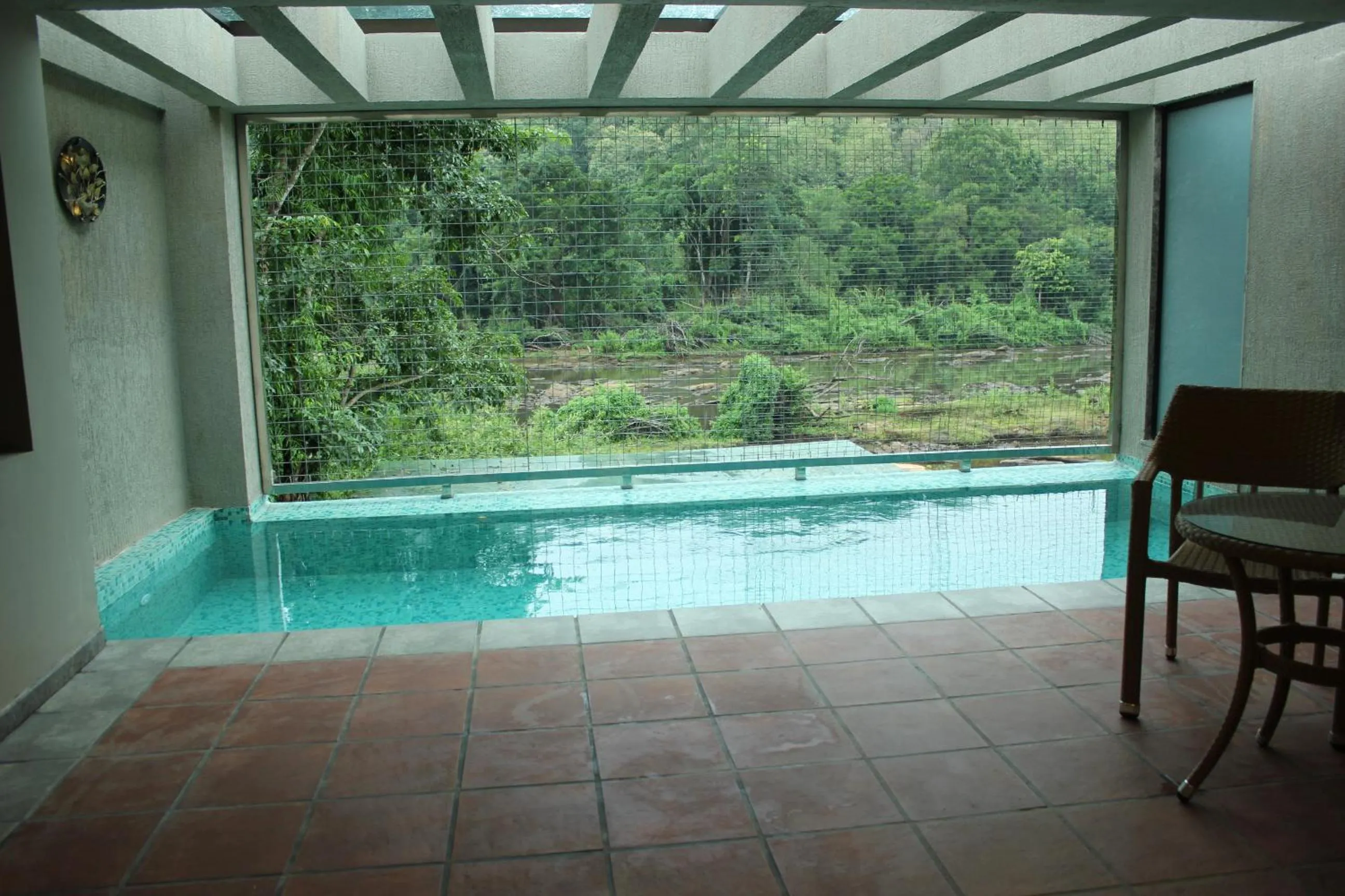 Pool view in Niraamaya Retreats Samroha Athirappilly