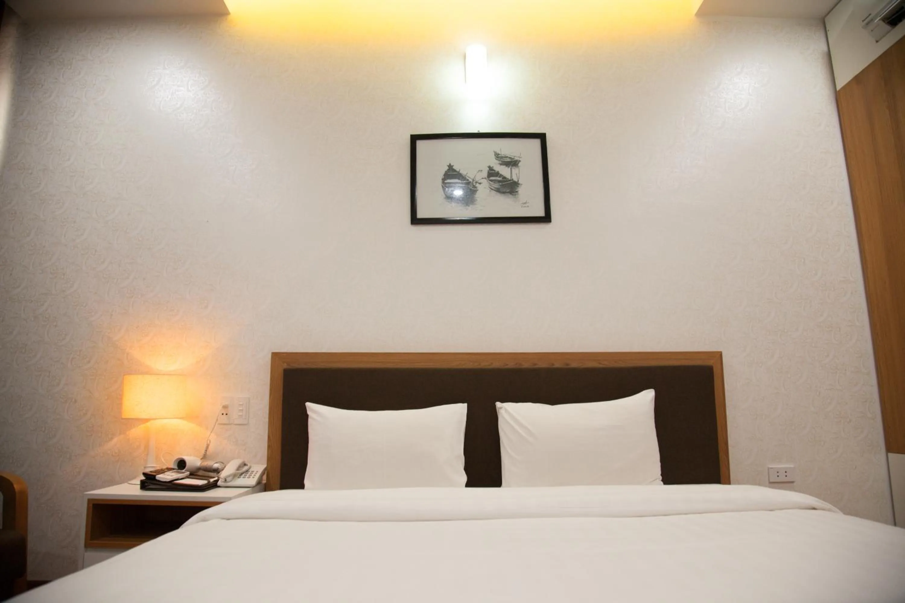 Bed in Bình Minh Hotel