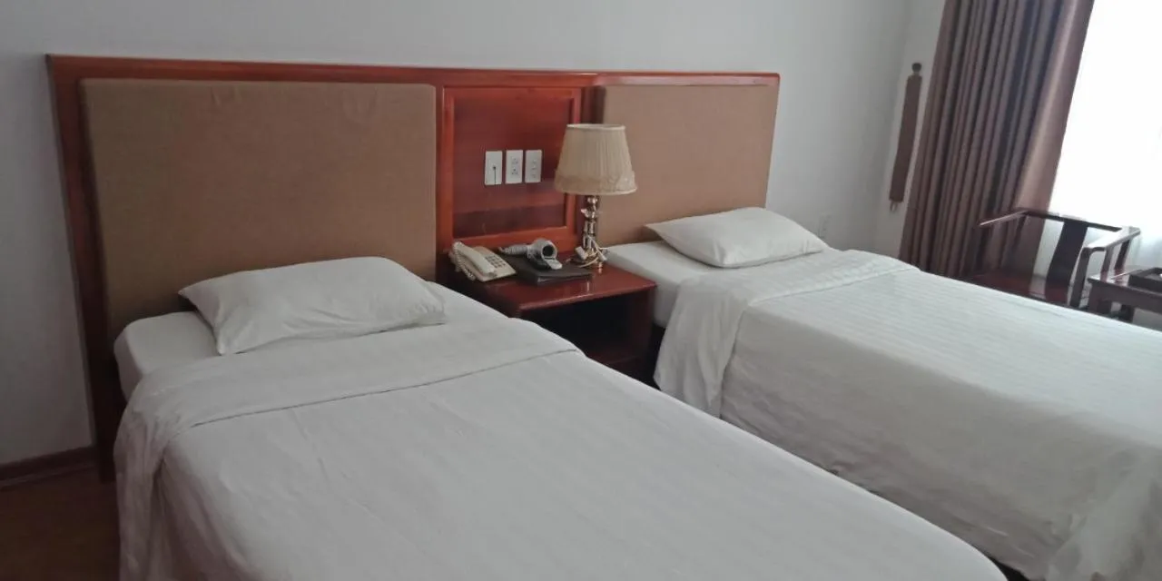 Bed in Bình Minh Hotel