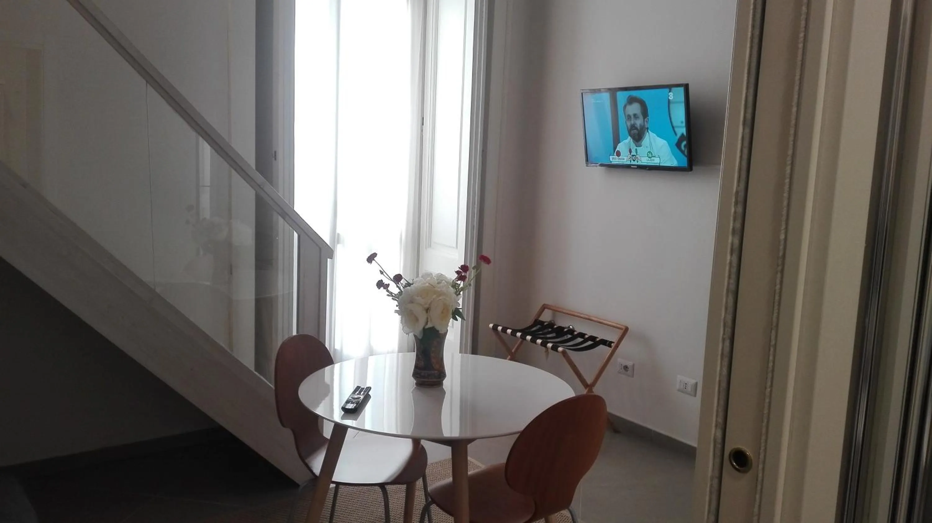 Dining area in Piano Nobile by Napoliapartments