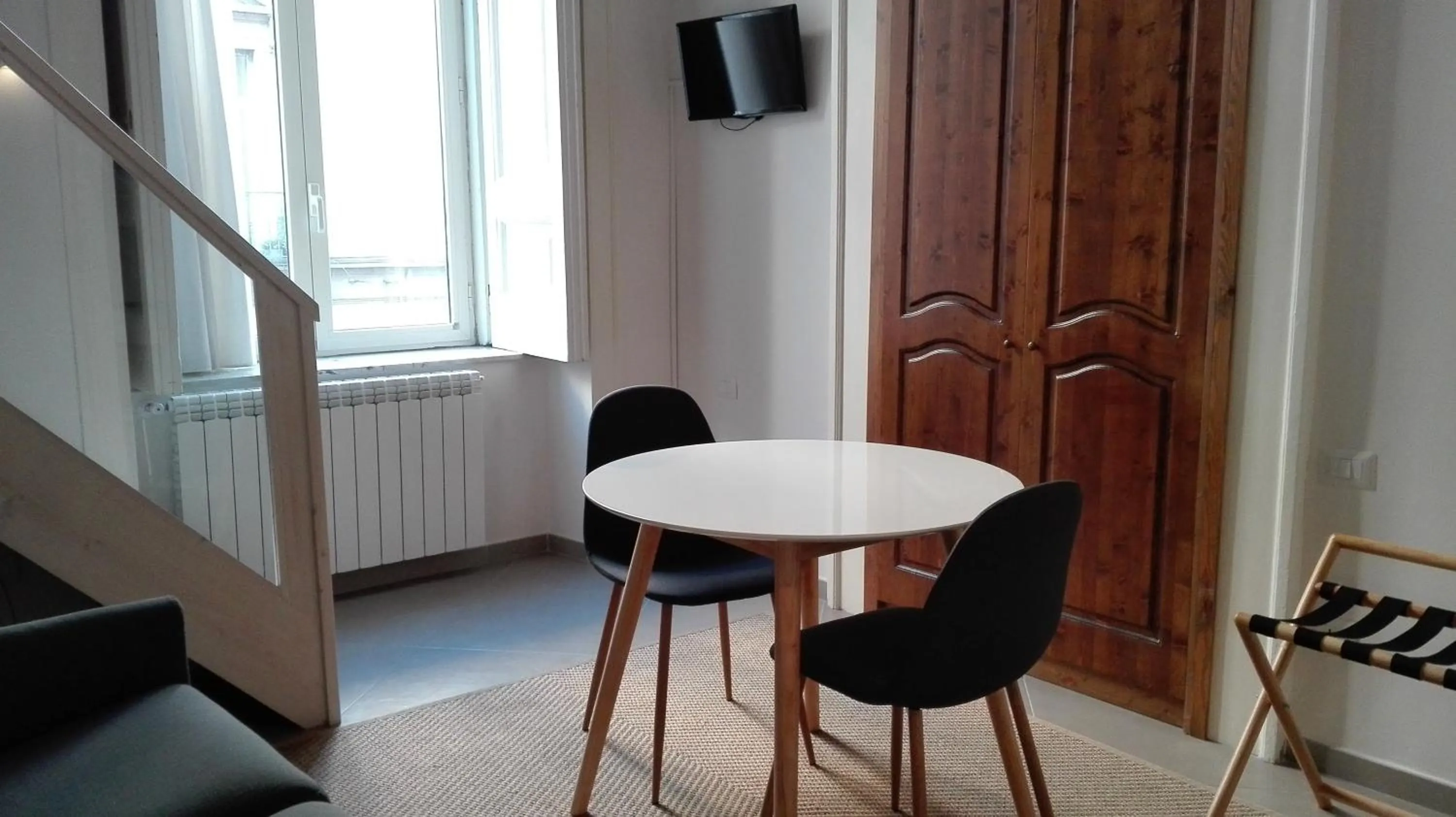 Seating area in Piano Nobile by Napoliapartments