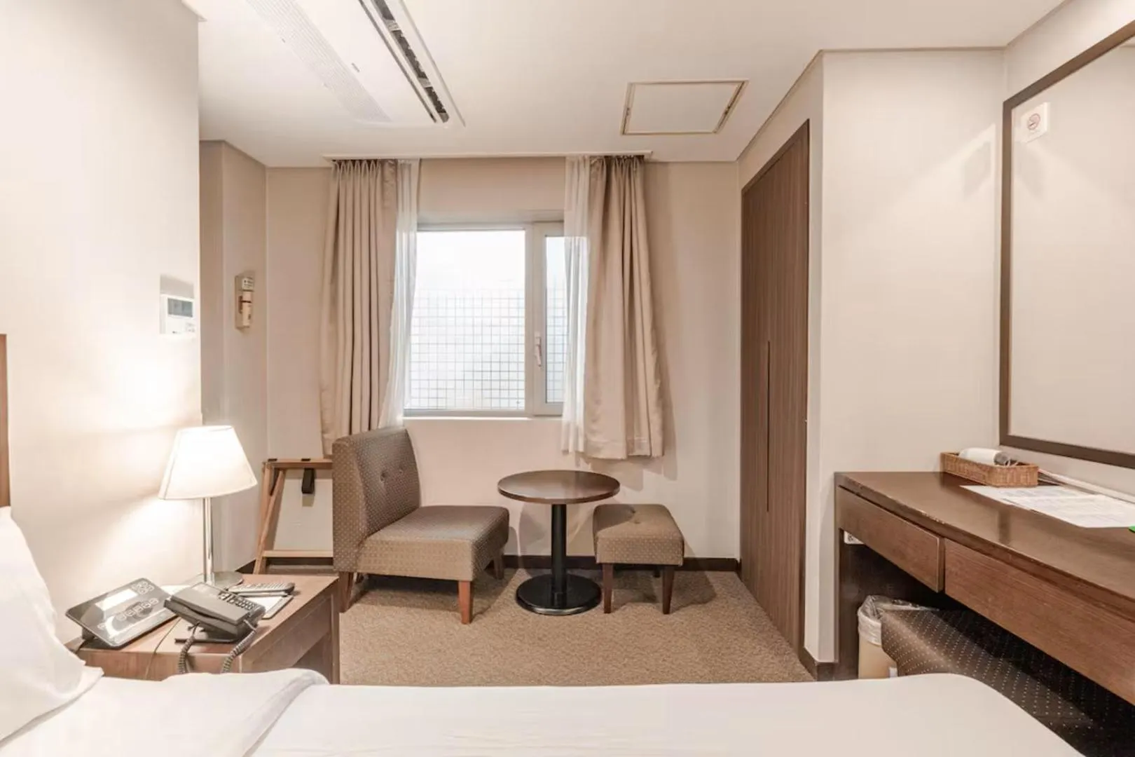 Bed in New Seoul Hotel Myeongdong