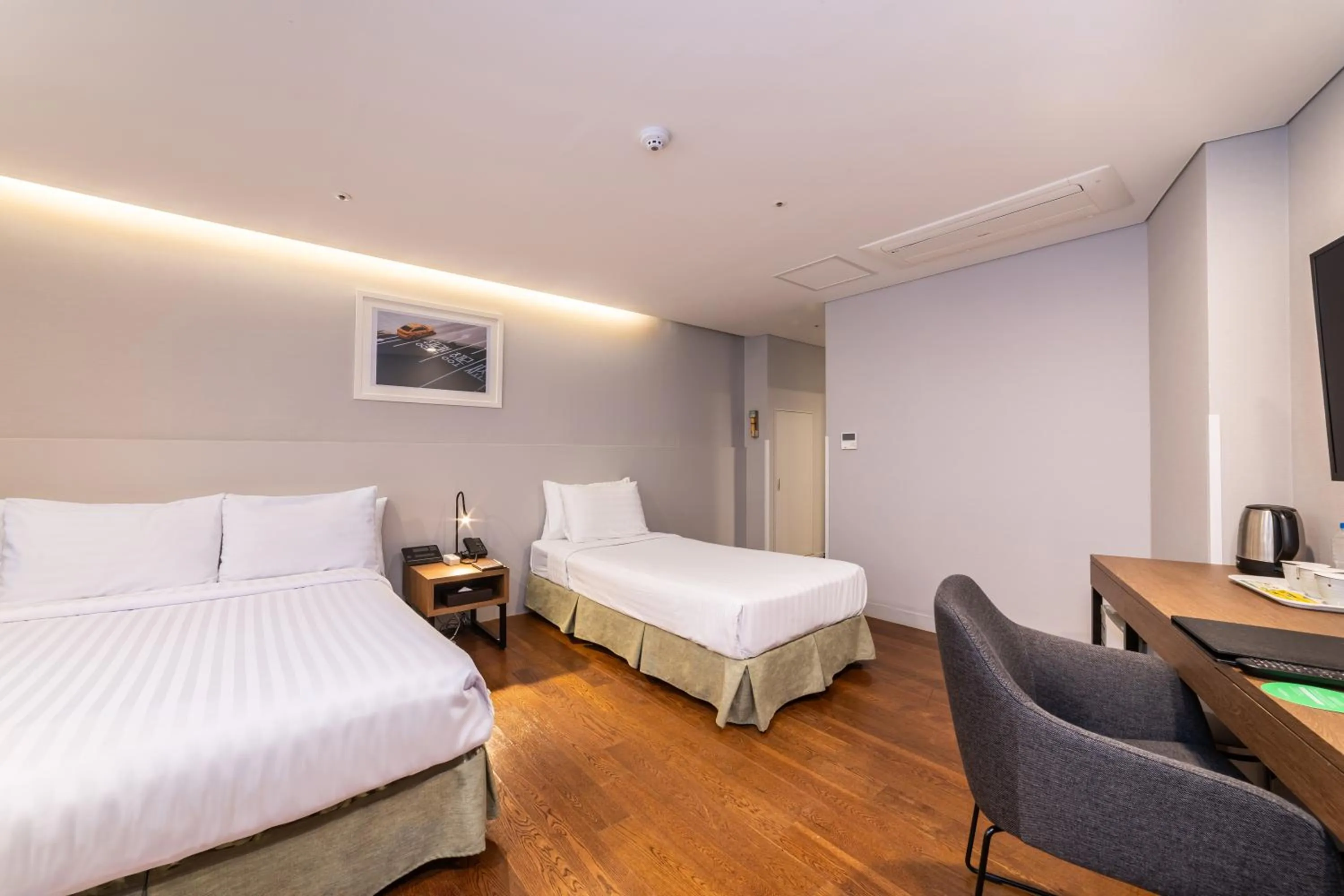 Bed in New Seoul Hotel Myeongdong