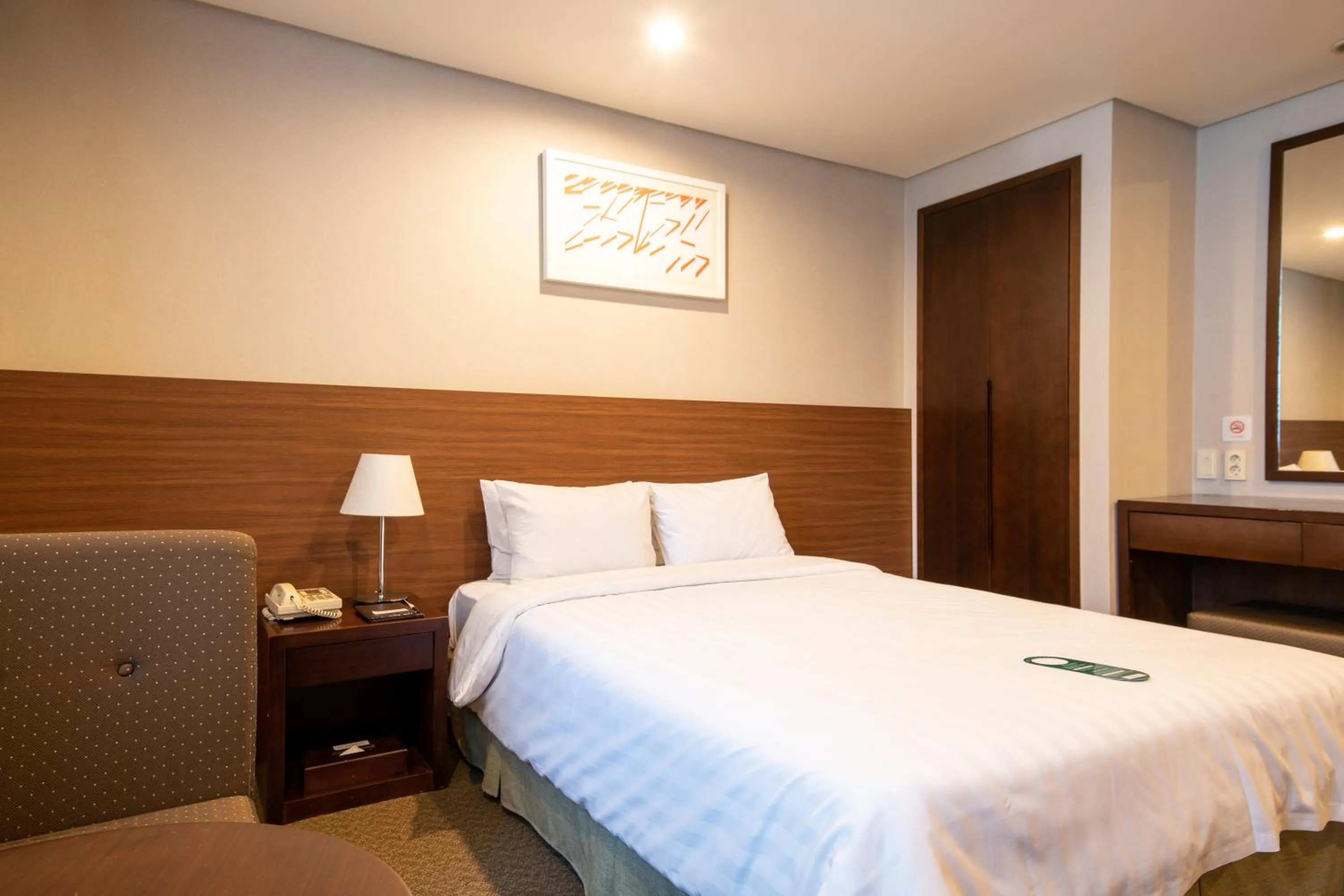 Bed in New Seoul Hotel Myeongdong