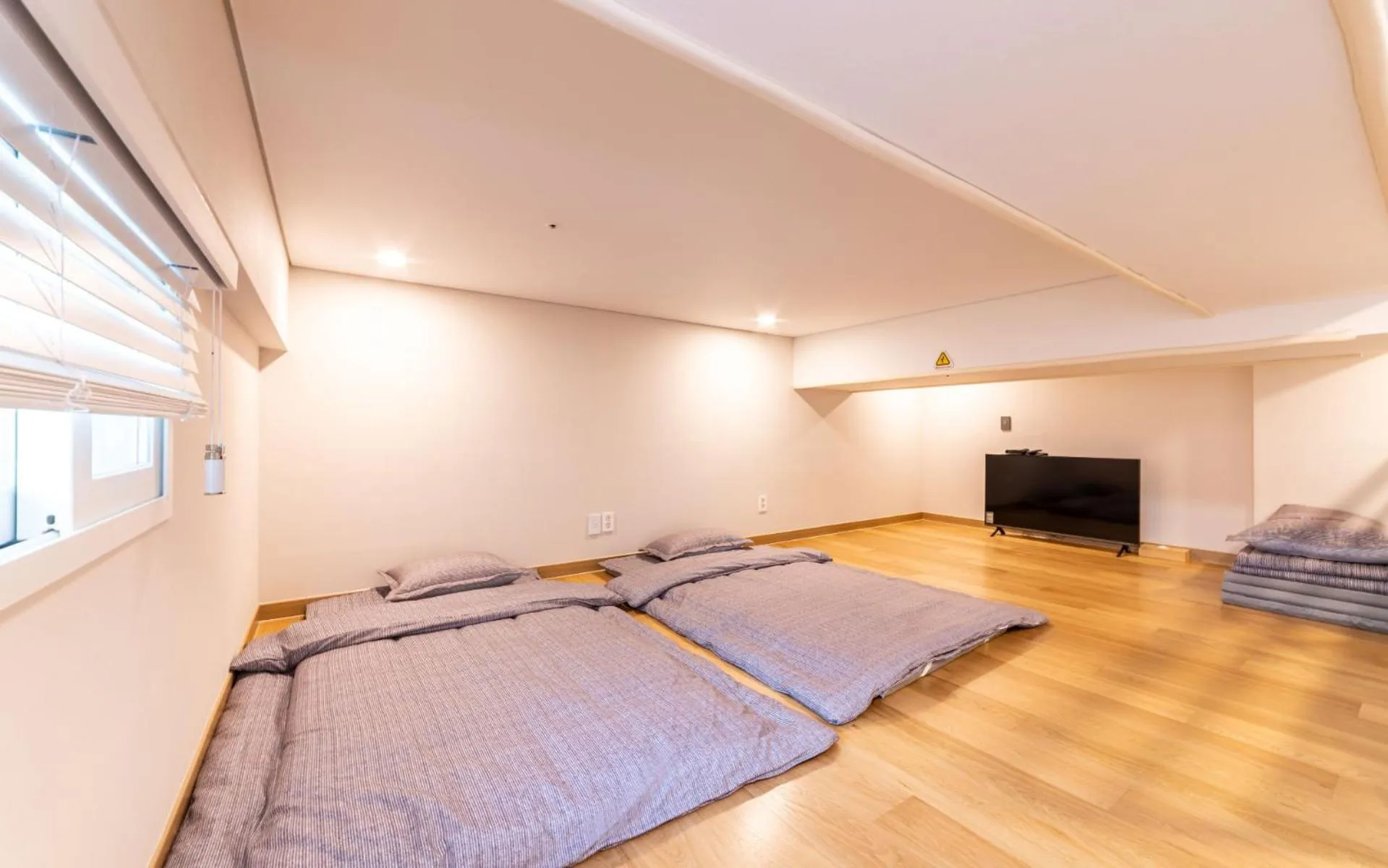 Bed in New Seoul Hotel Myeongdong