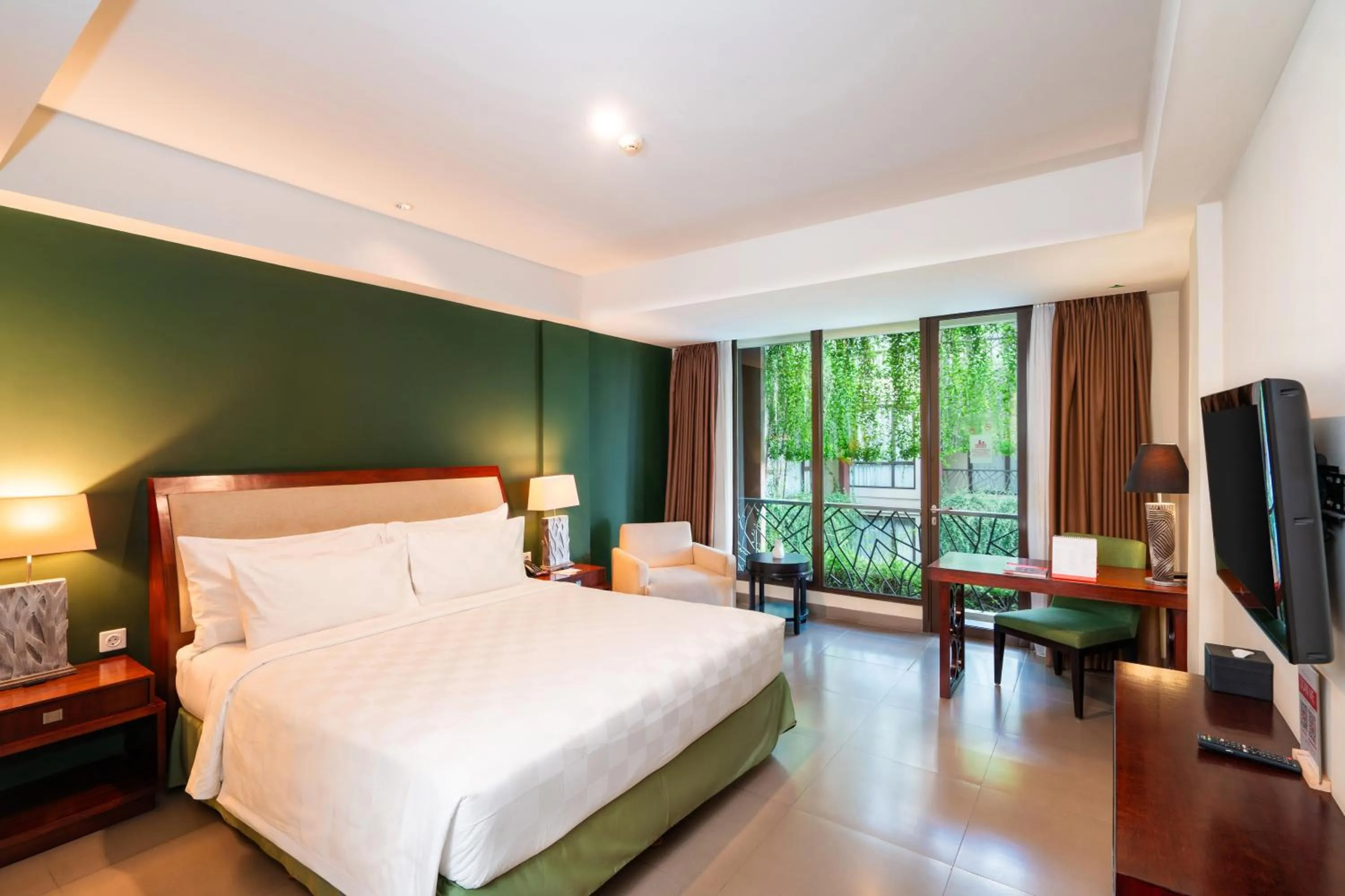 Bed in Swiss-Belhotel Rainforest