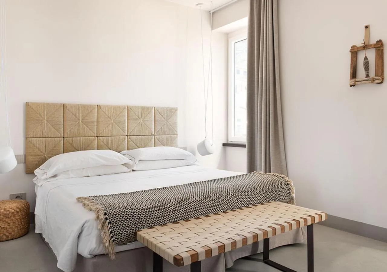 Bed in LA GUARDIA Hotel