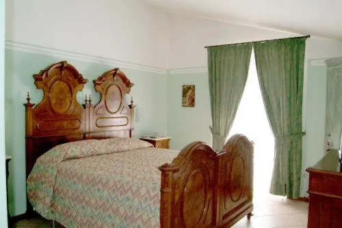 Bed in Albergo Olivo