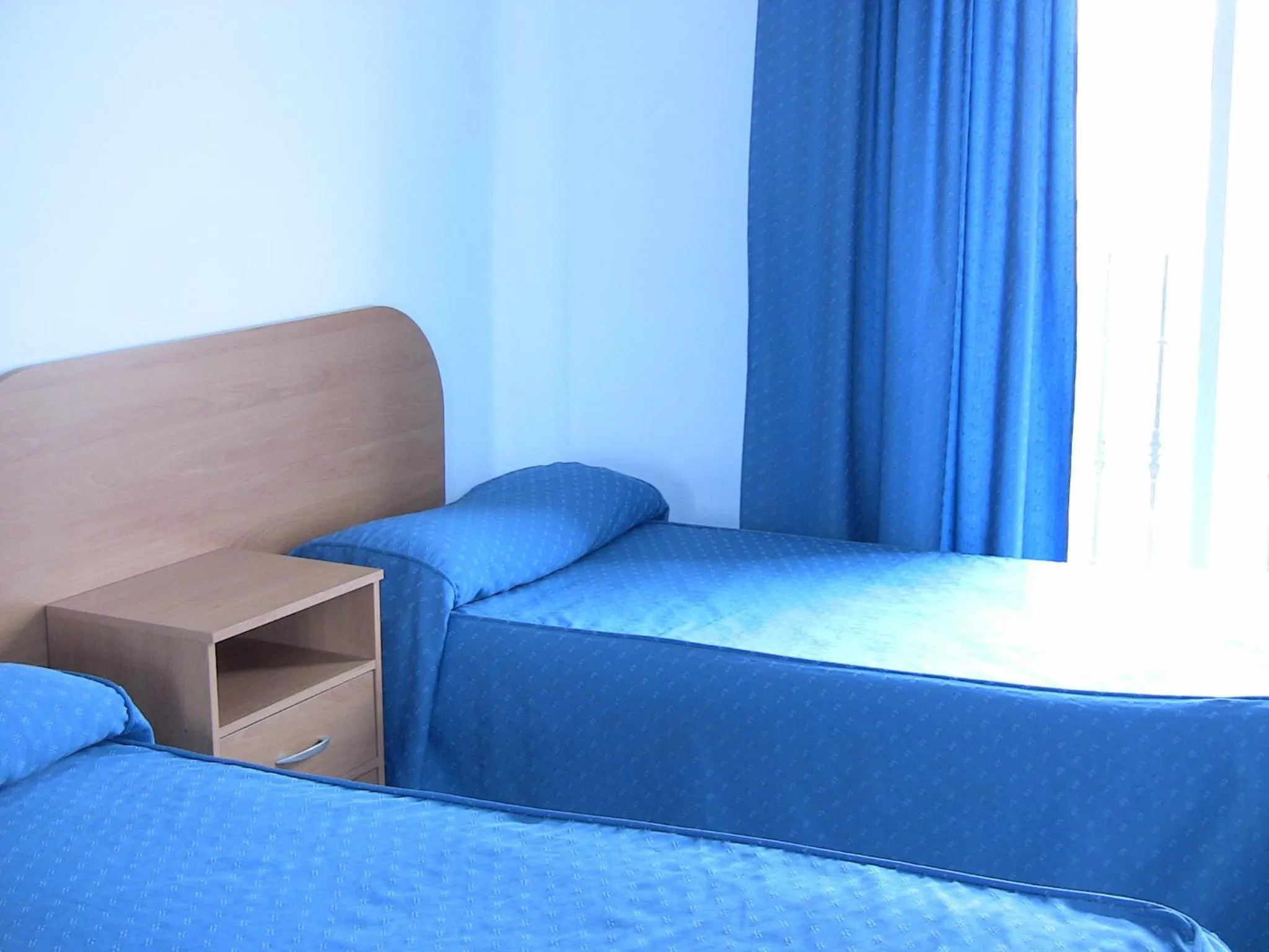 Bed in Apartahotel Los Hermanos