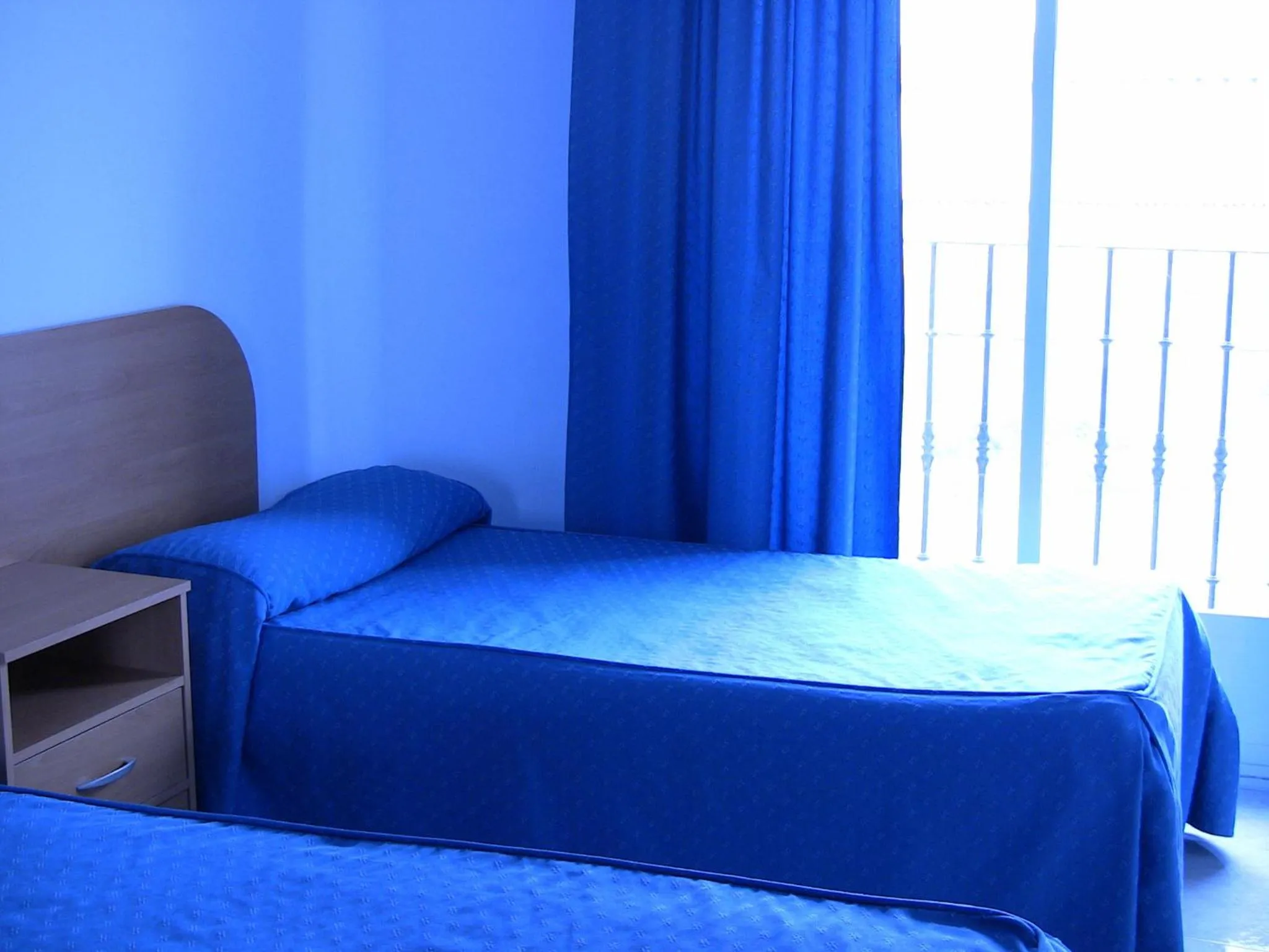 Bed in Apartahotel Los Hermanos