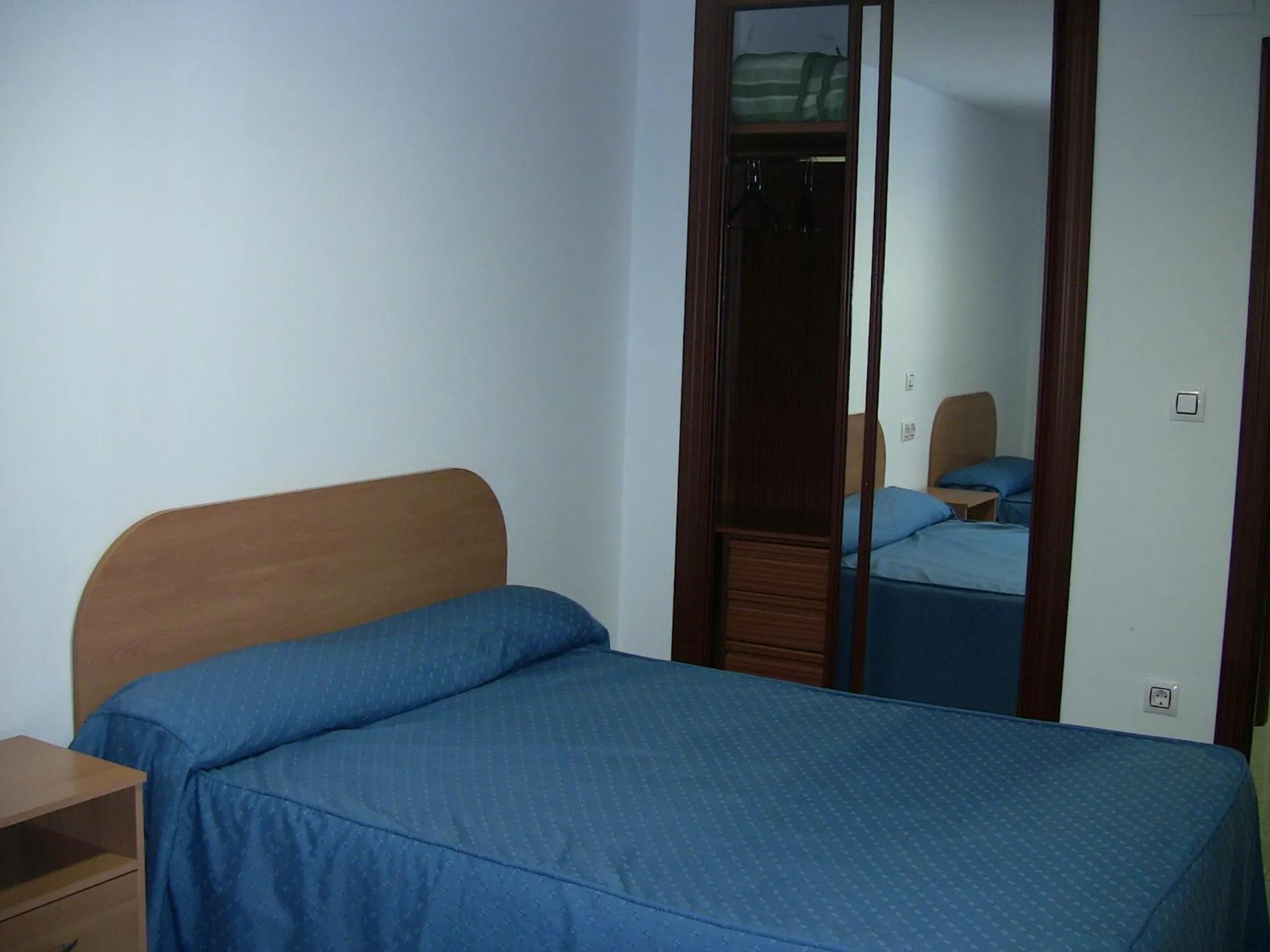 Bed in Apartahotel Los Hermanos