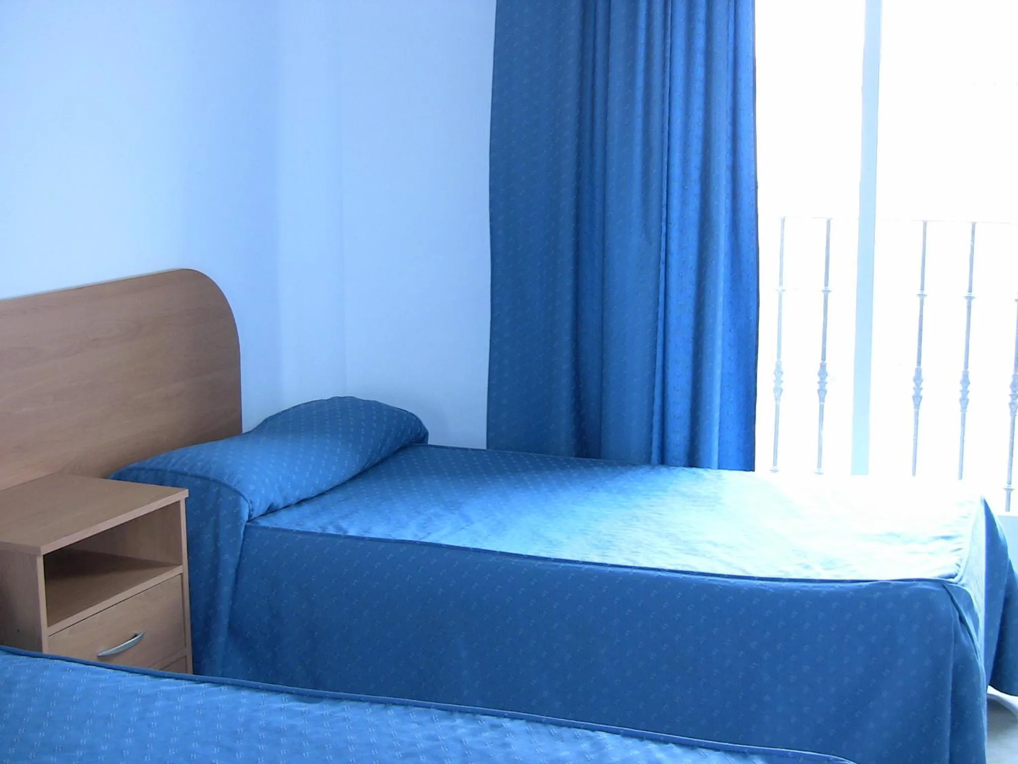 Bed in Apartahotel Los Hermanos