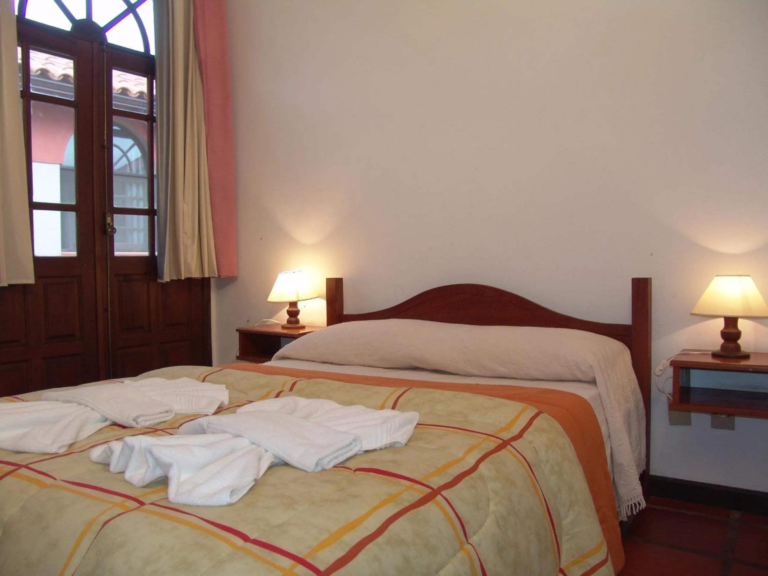 Bed in La Alhambra Apart Hotel