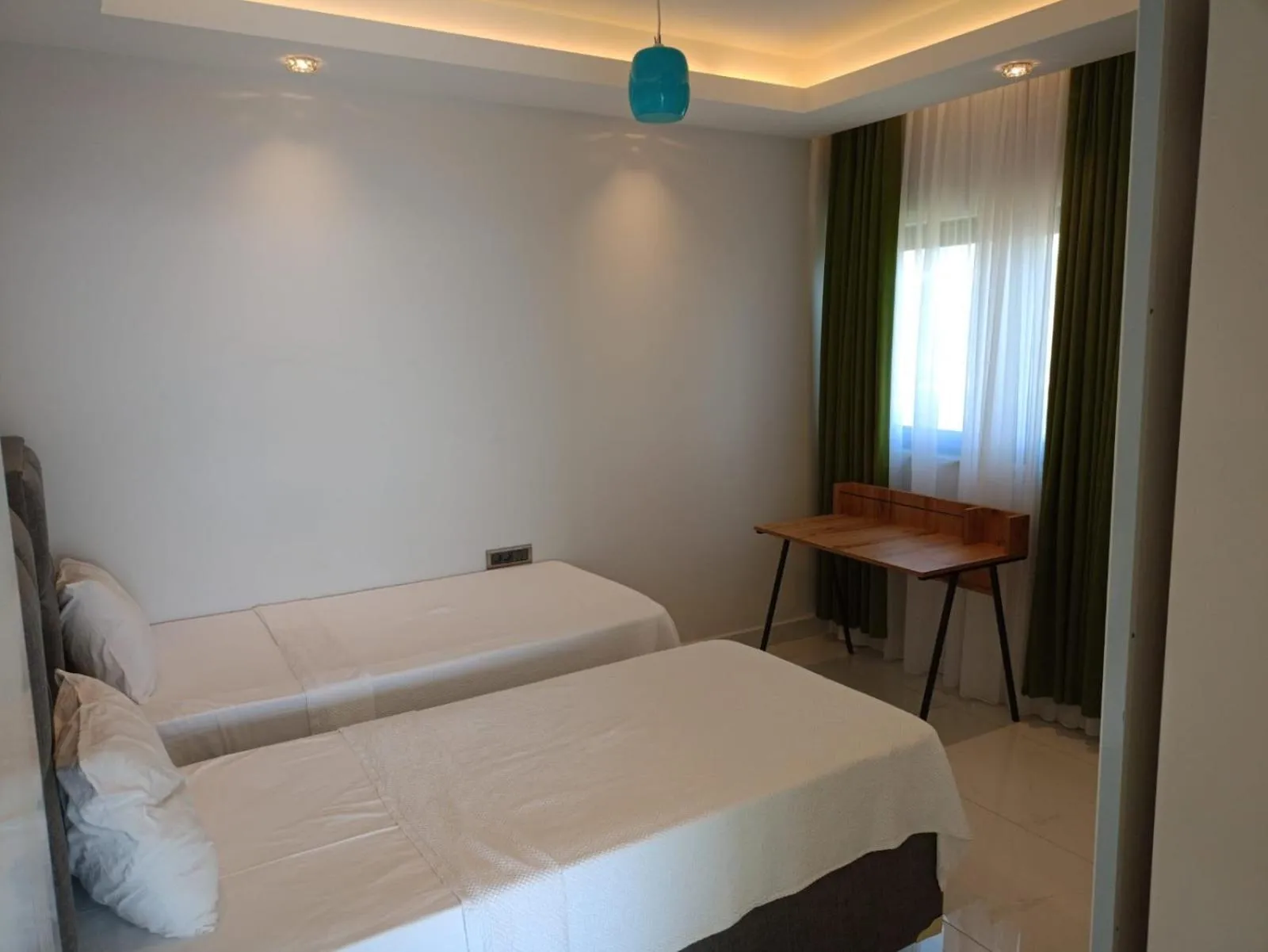 Bed in Elite Luxury Suite & Spa