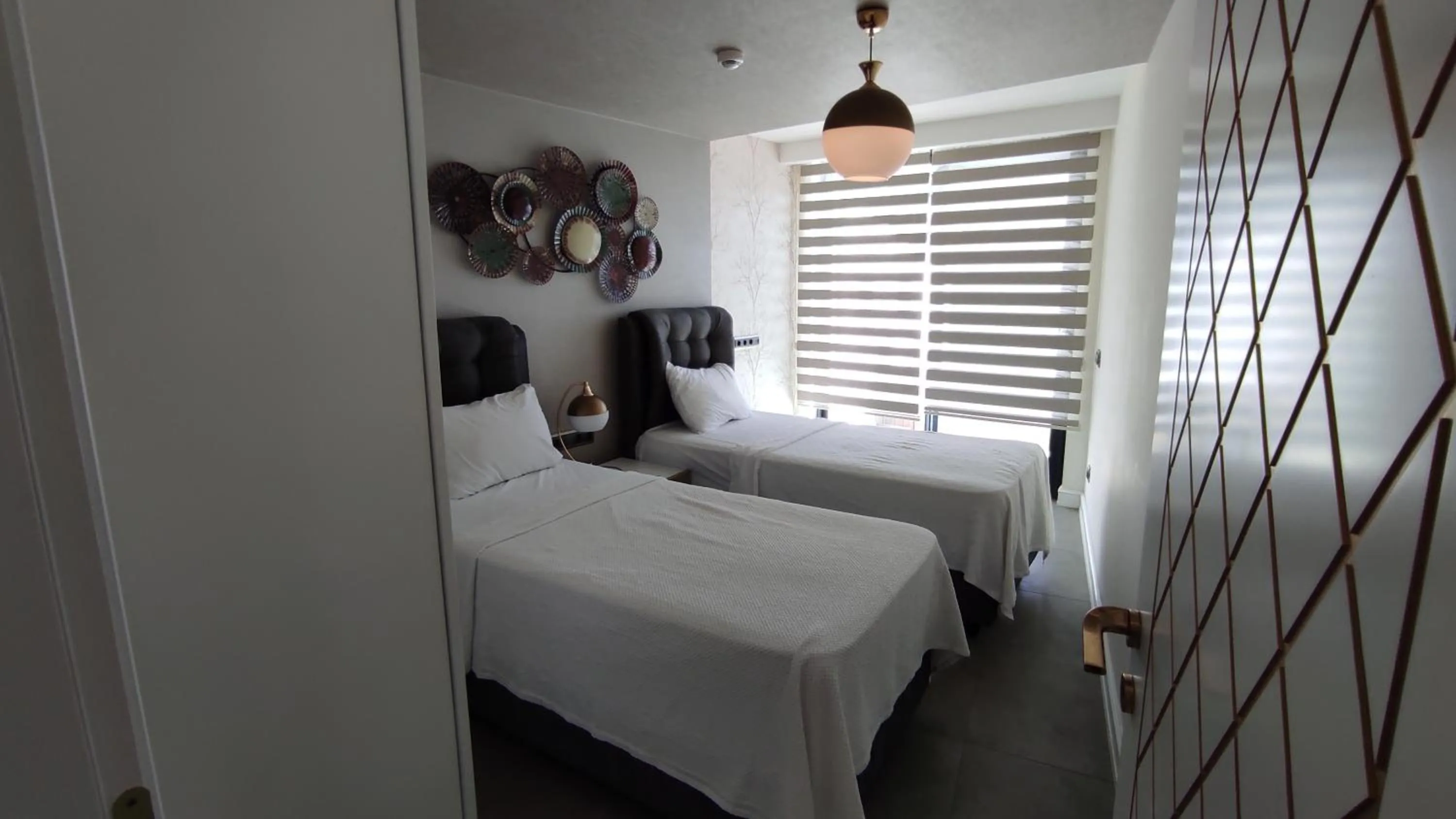 Bed in Elite Luxury Suite & Spa