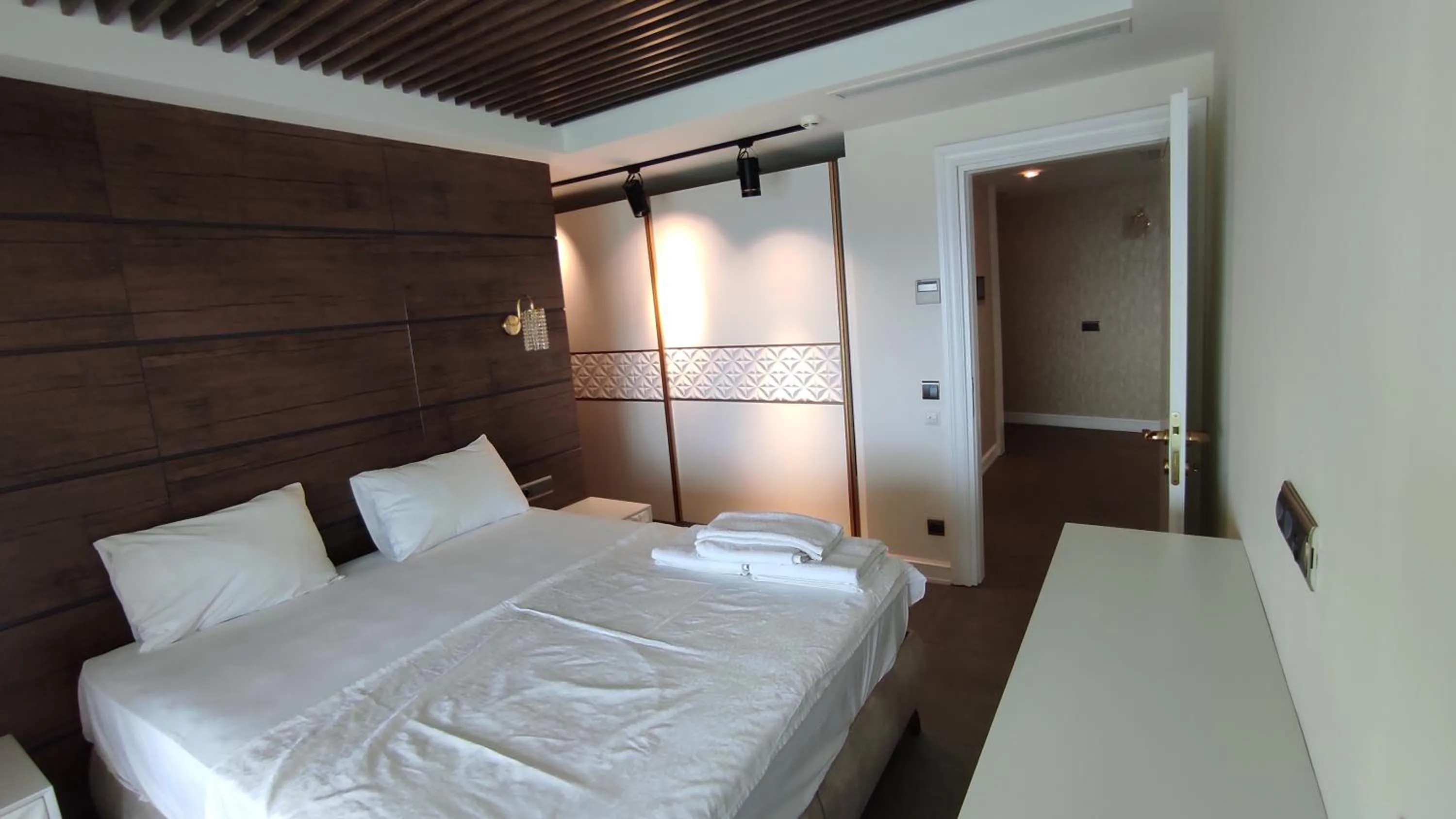 Bed in Elite Luxury Suite & Spa