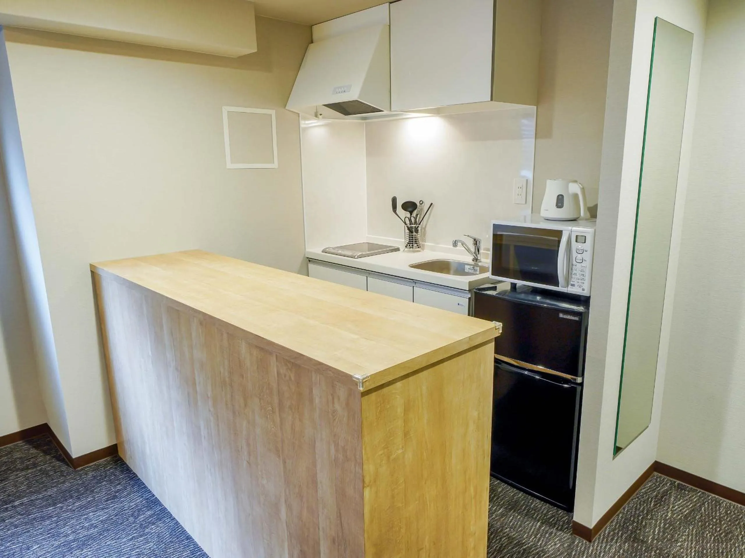 Kitchen or kitchenette in RESI STAY Heart