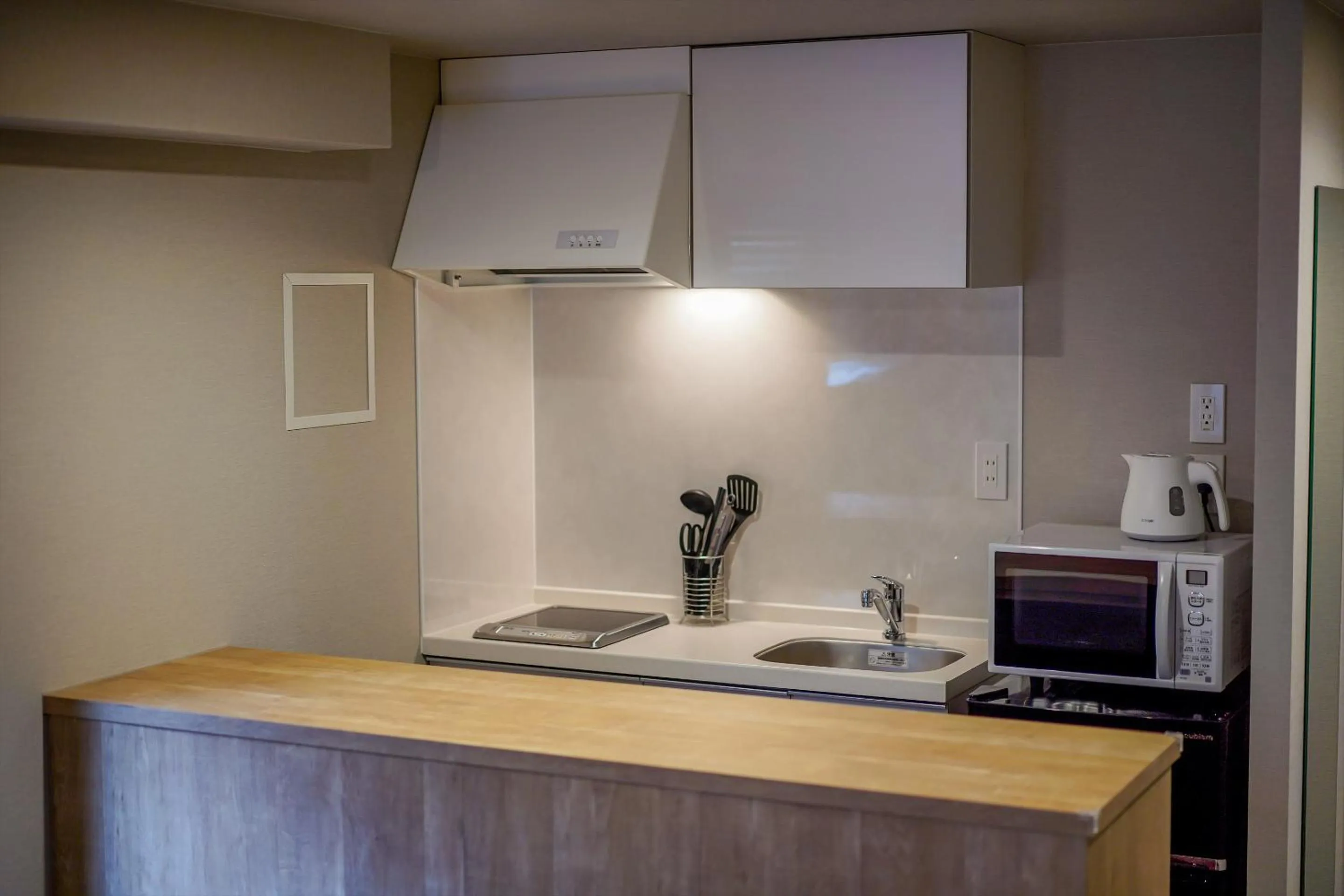 Kitchen or kitchenette in RESI STAY Heart