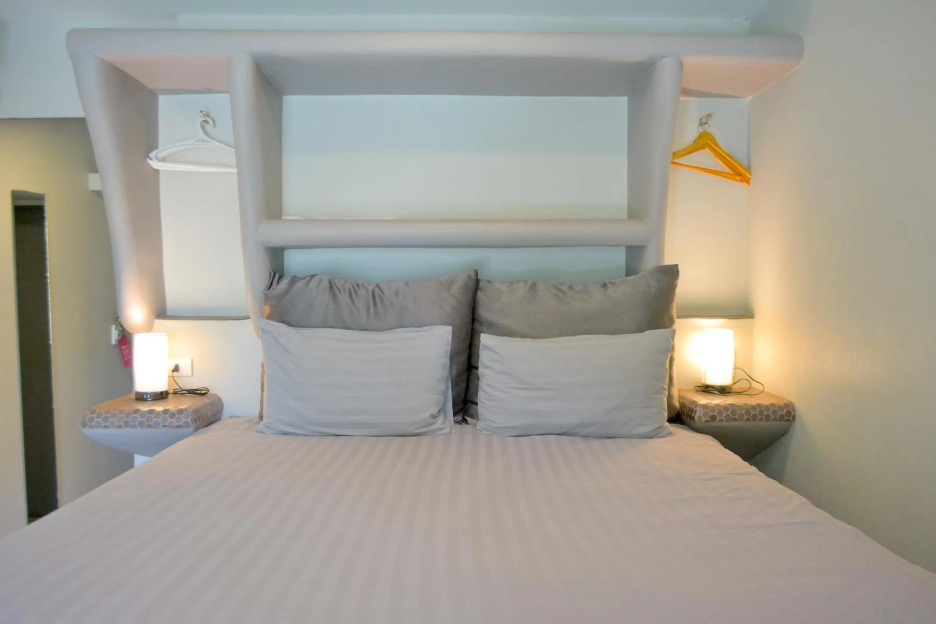 Bed in Le Divine Comedie Beach Resort