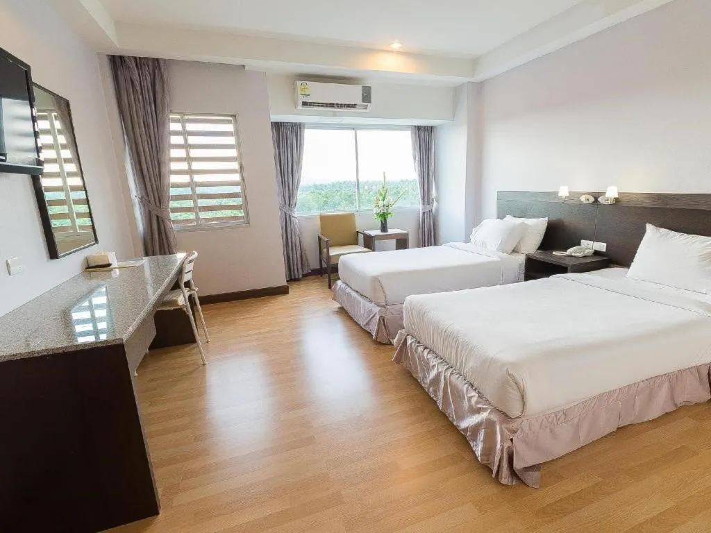 Bed in SinKiat Buri Hotel