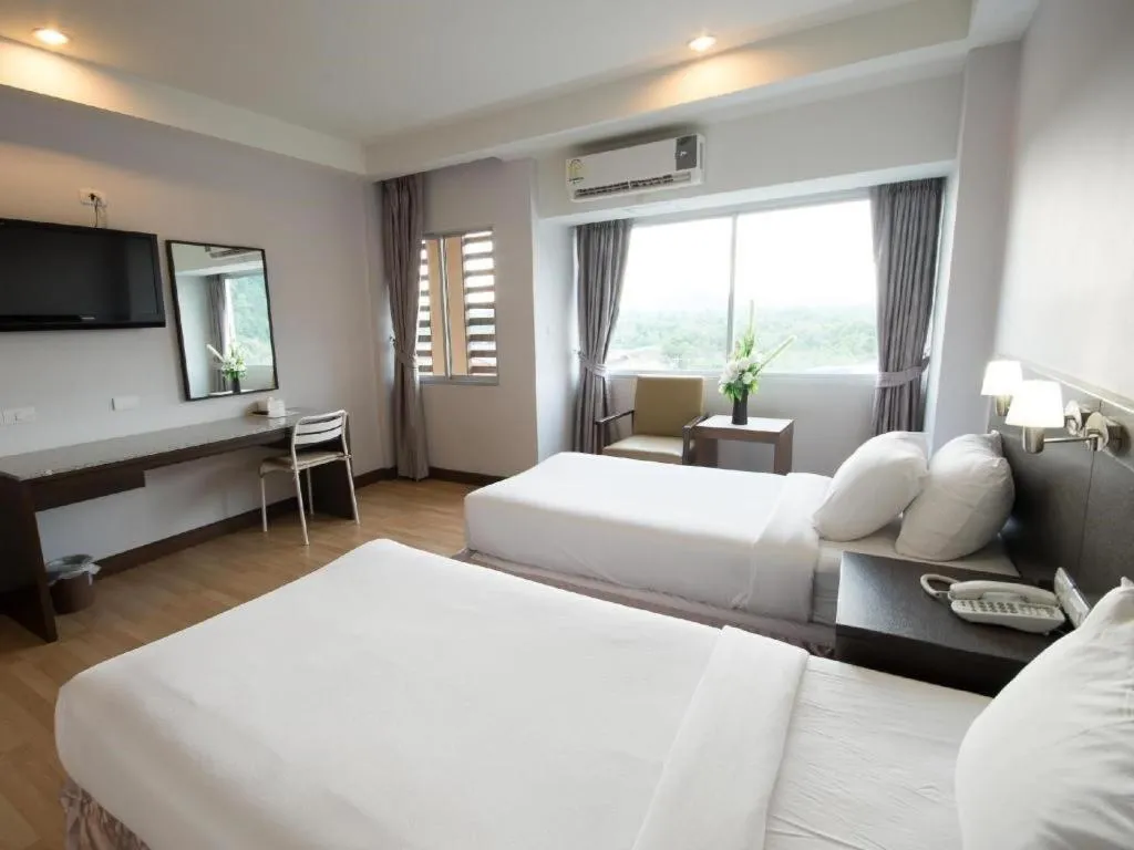 Bed in SinKiat Buri Hotel