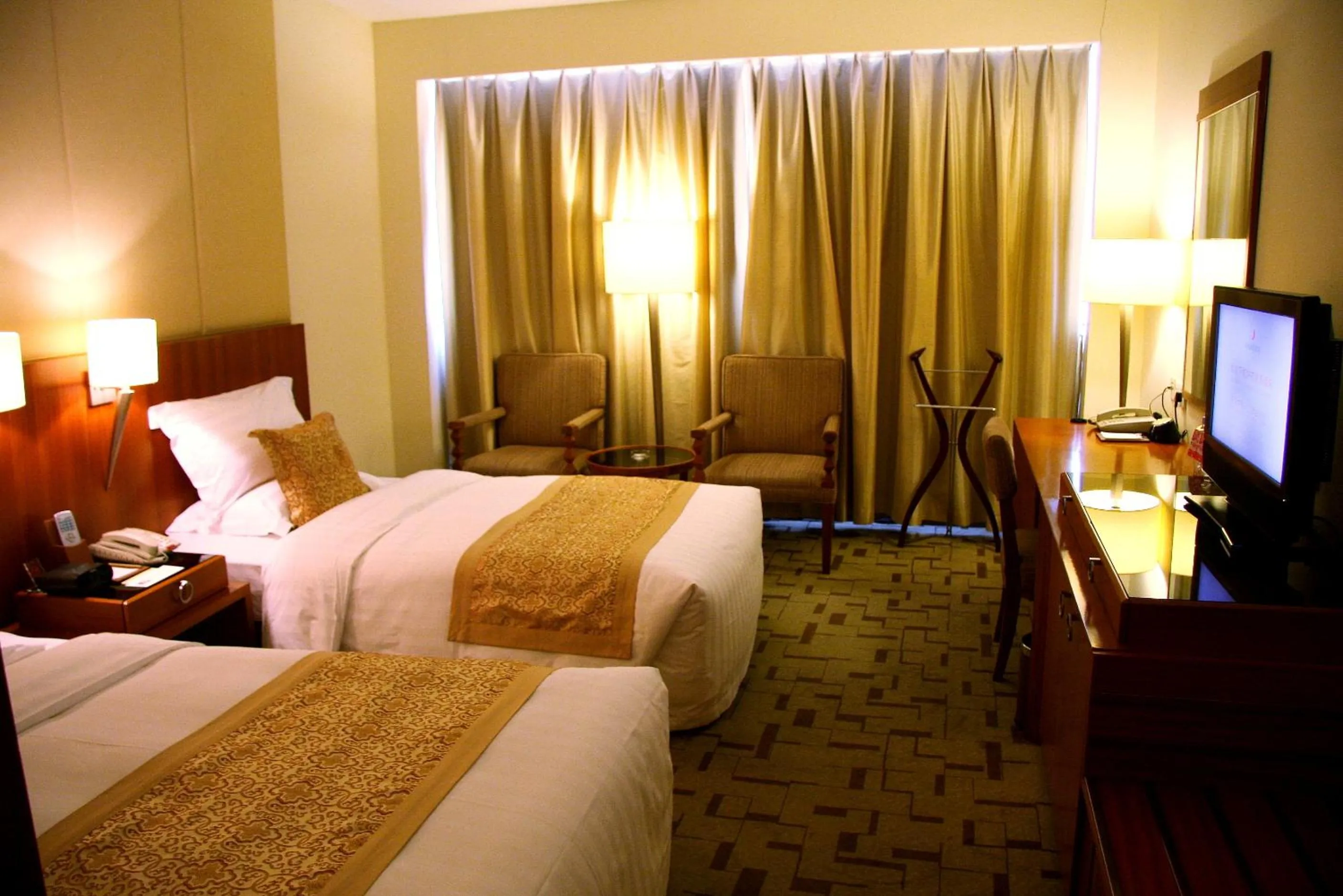 Bed in Jianguo Garden Hotel