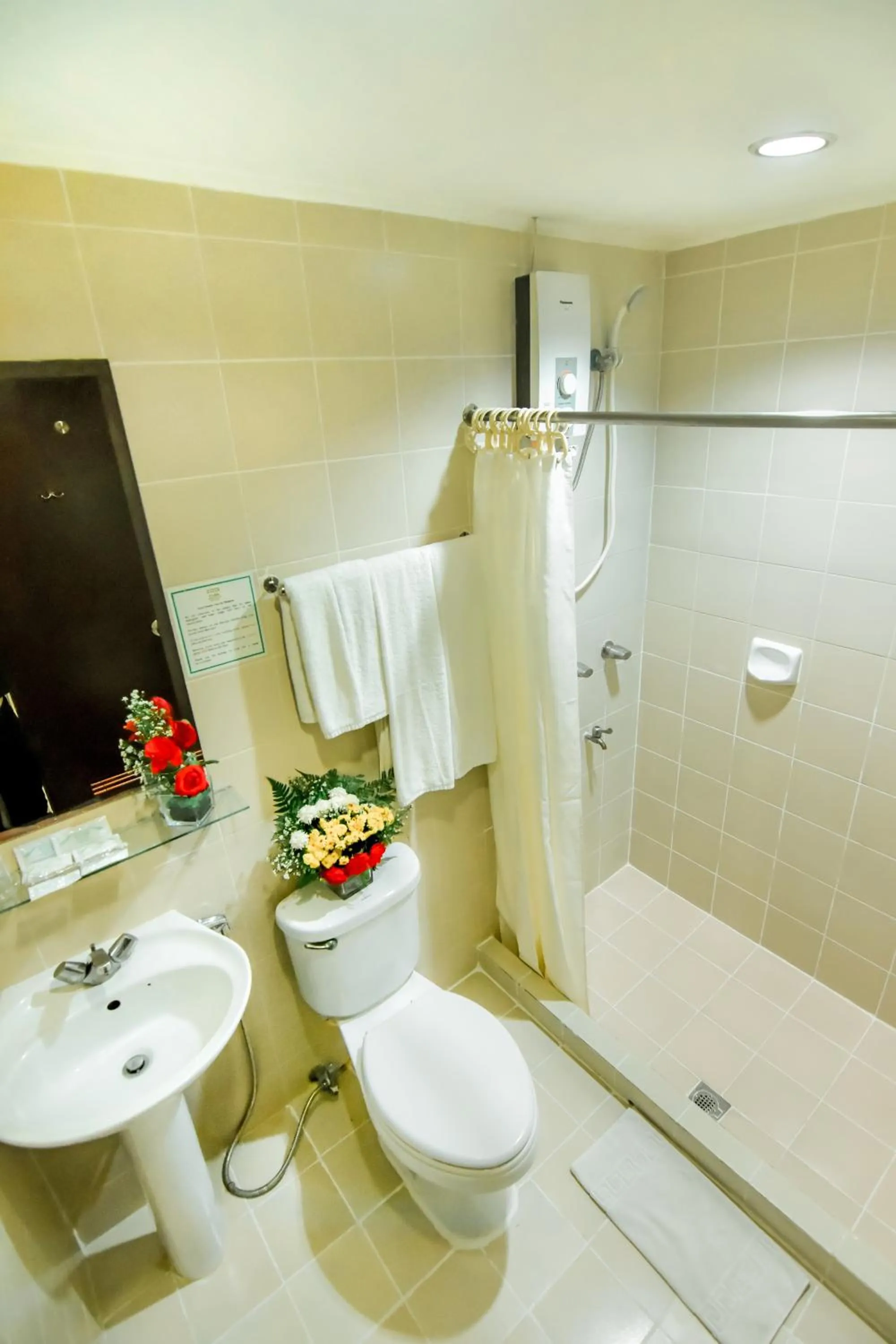 Bathroom in Rajah Park Hotel by Hiverooms