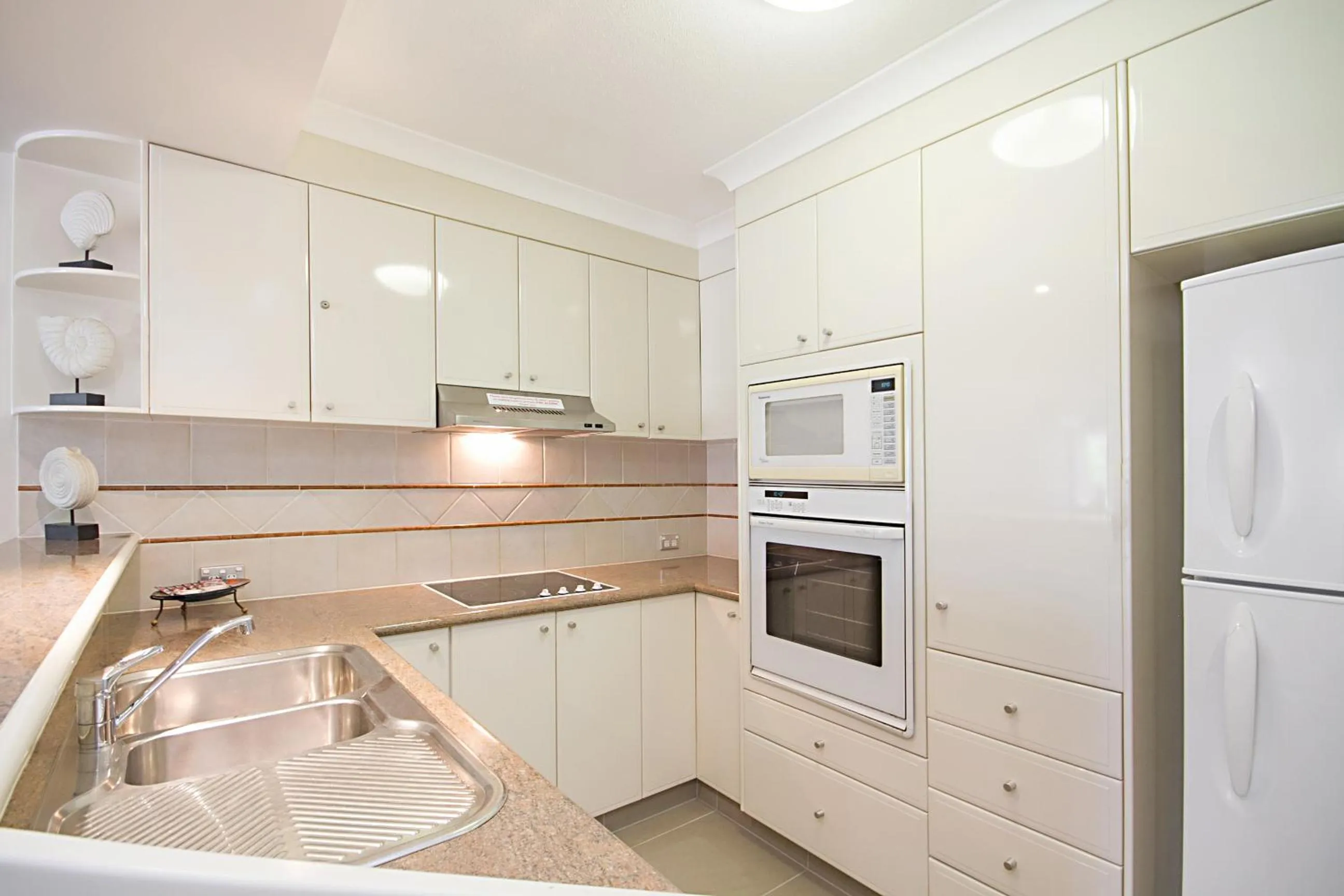 Kitchen or kitchenette in ULTIQA Burleigh Mediterranean Resort