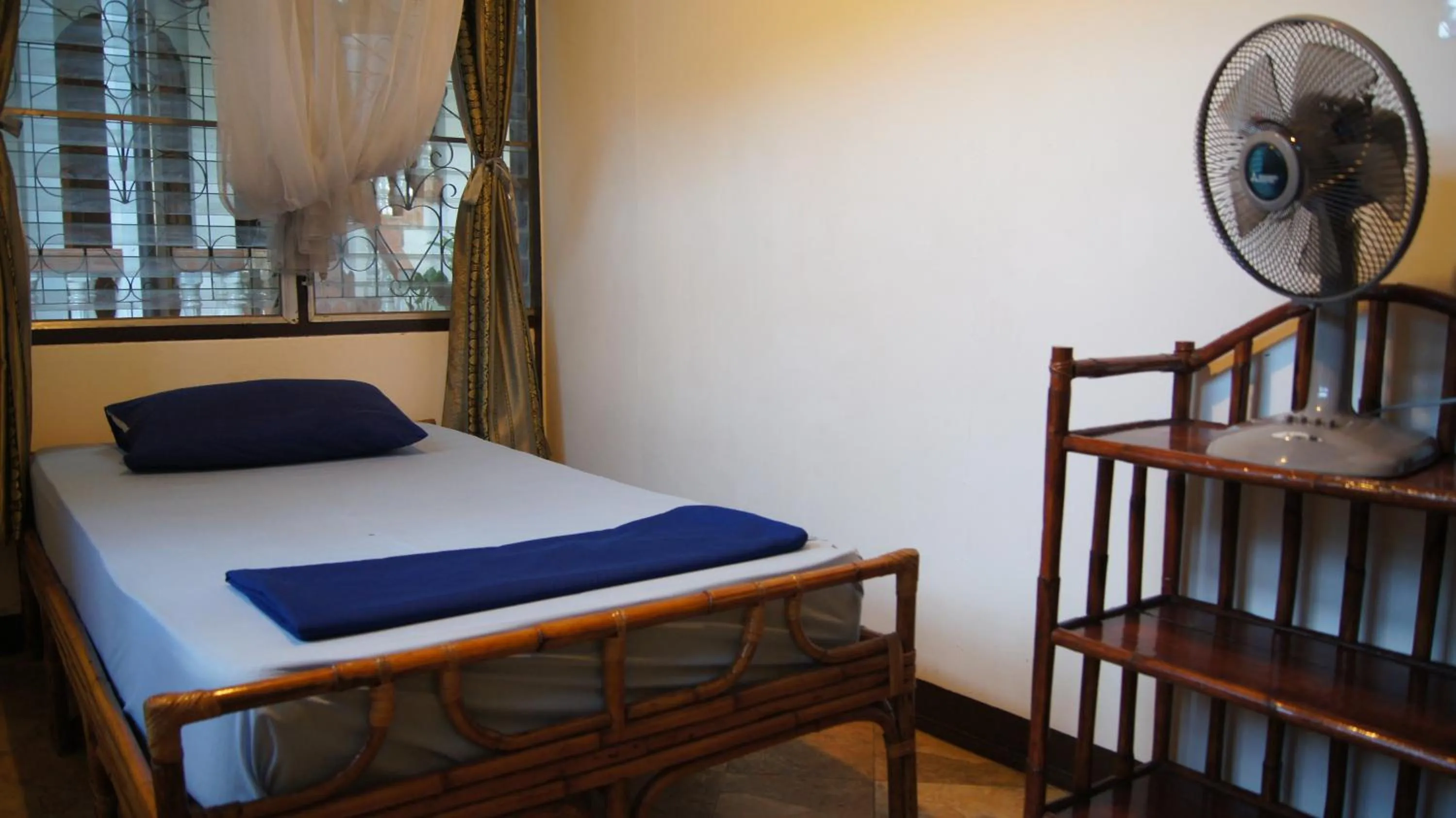 Bed in Mut Mee Garden Guest House