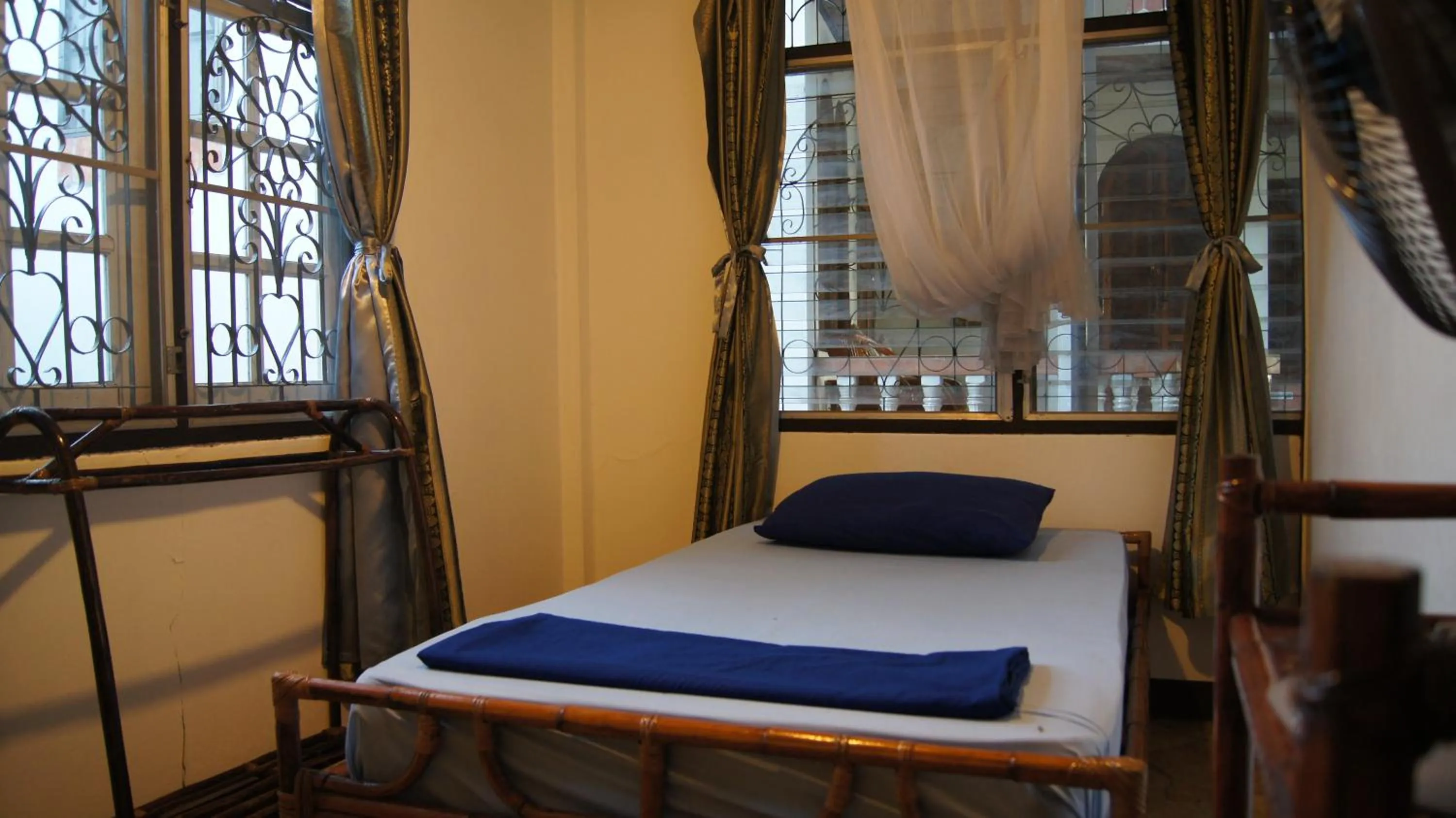 Bed in Mut Mee Garden Guest House