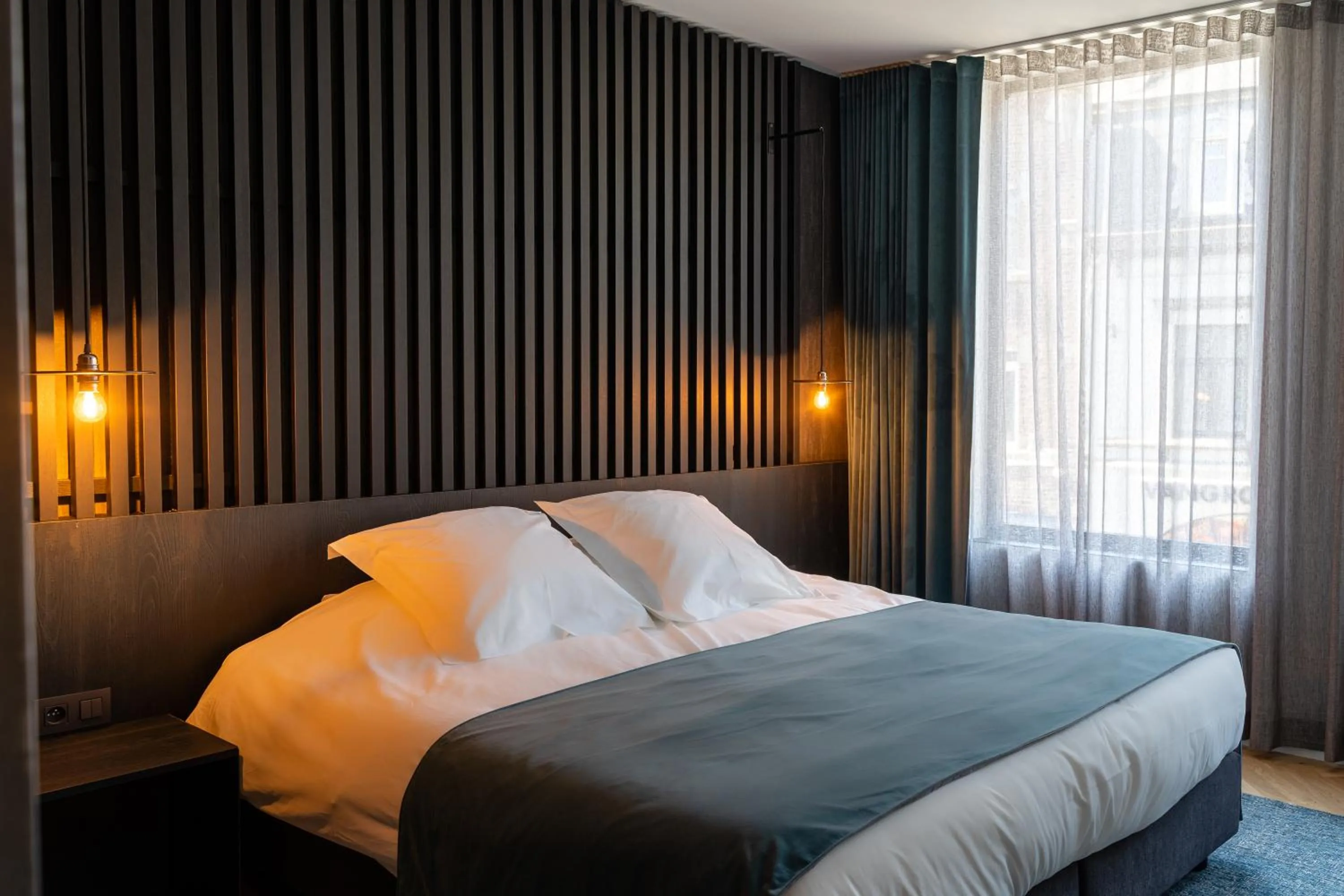 Bed in Designhotel Beila