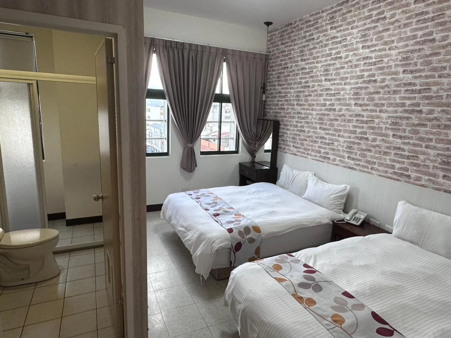 Bed in Jia-Jia Business Hotel