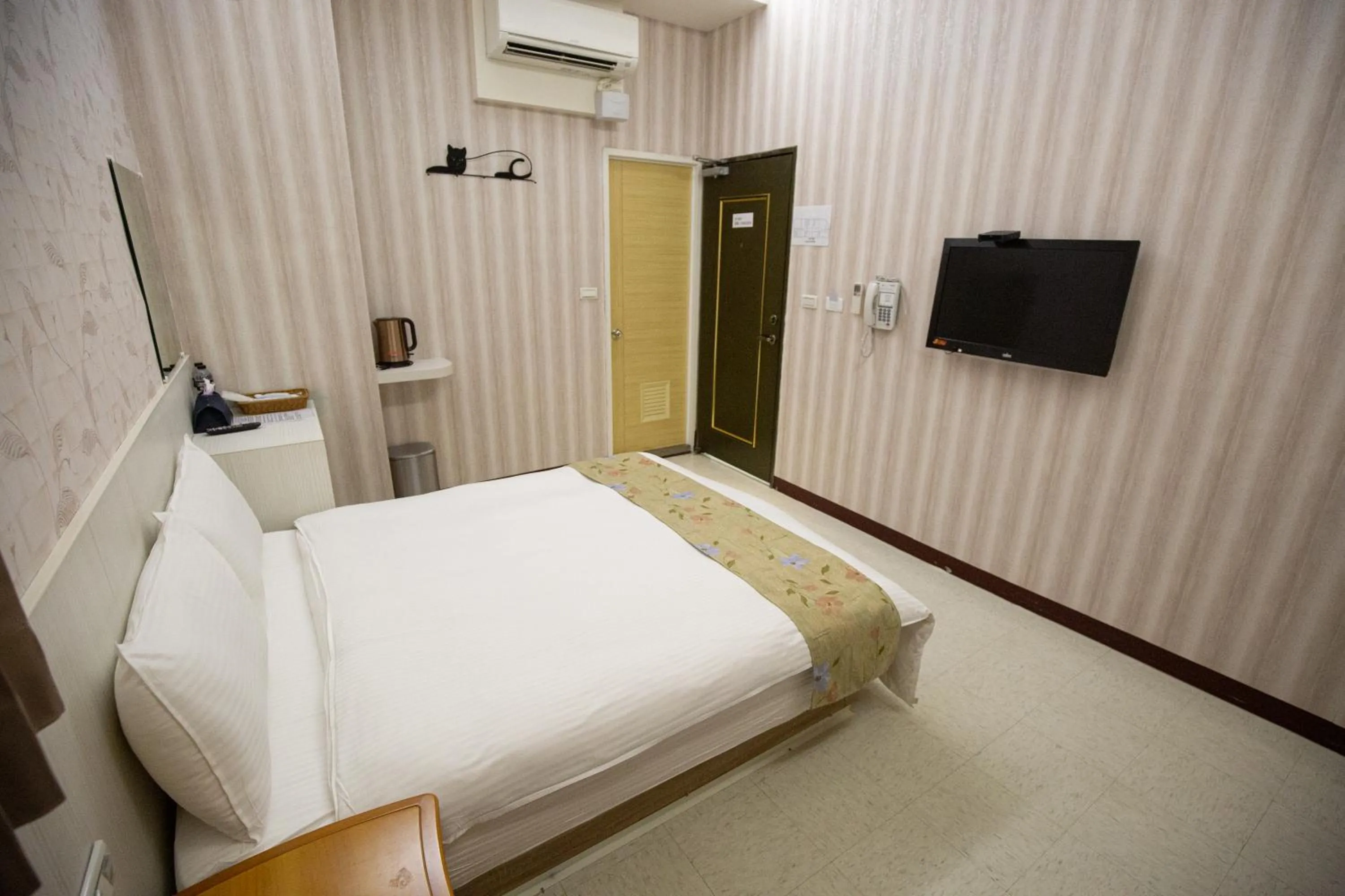 Bed in Jia-Jia Business Hotel