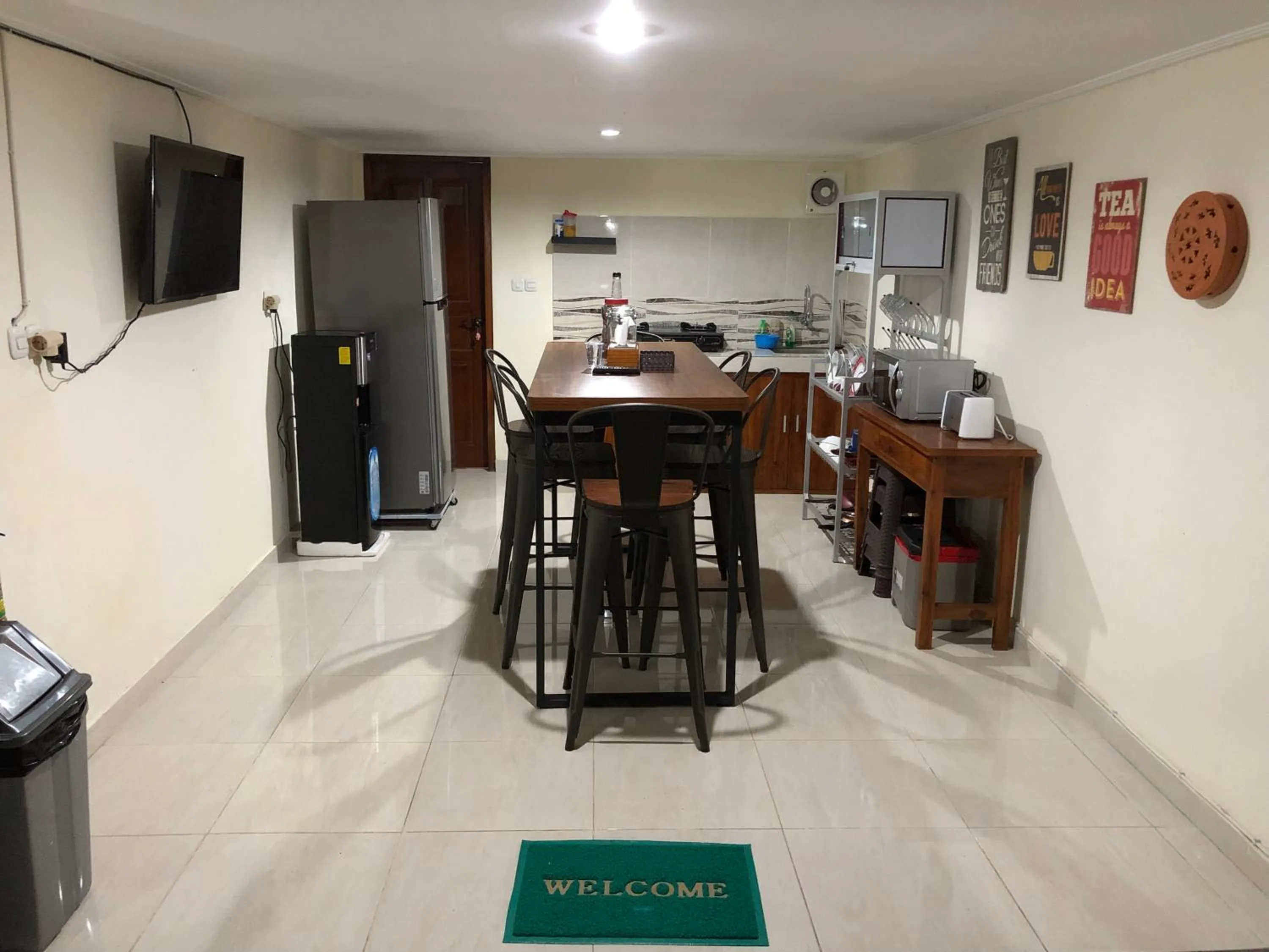 Communal lounge/ TV room in DeRose Guest House