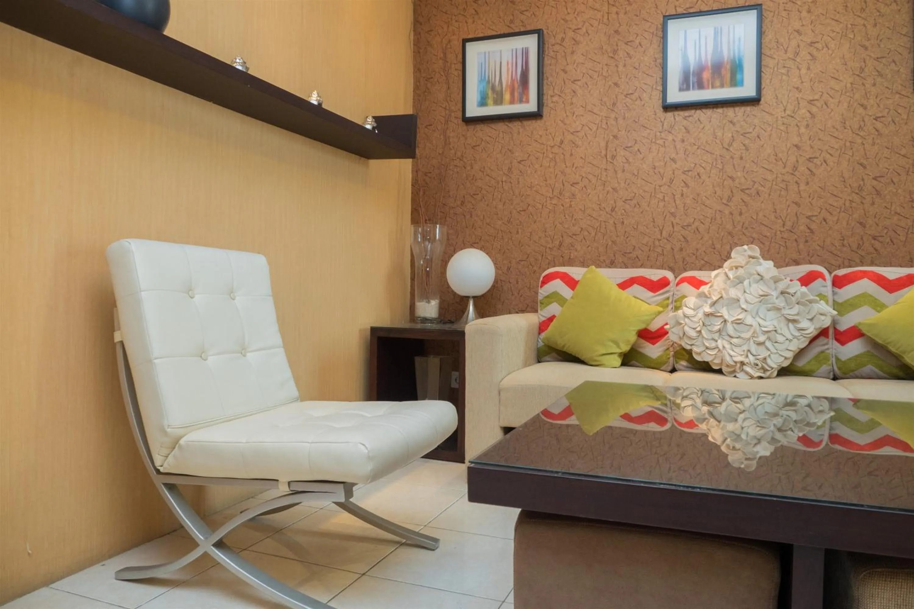 Seating area in Antique 3BR at Grand Setiabudi Apartment By Travelio