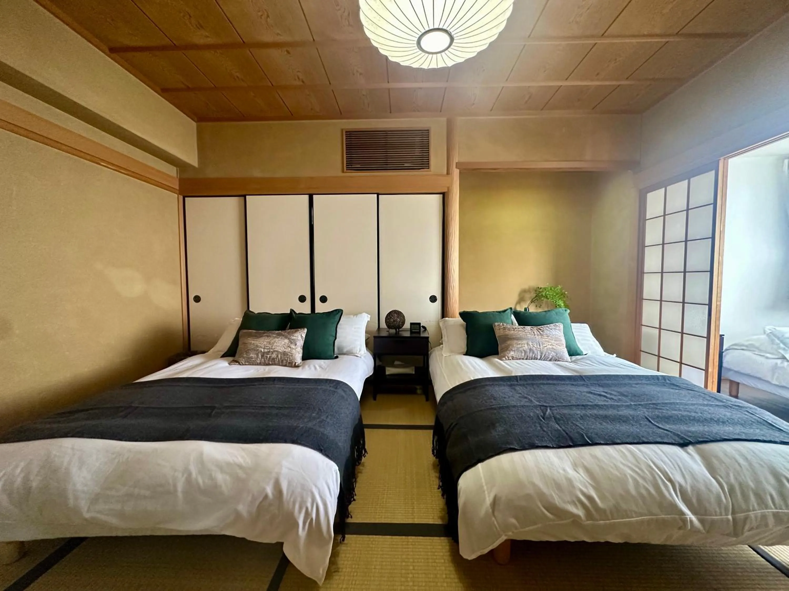 Bed in Crest Daikoku Owner's room -vacation rental-