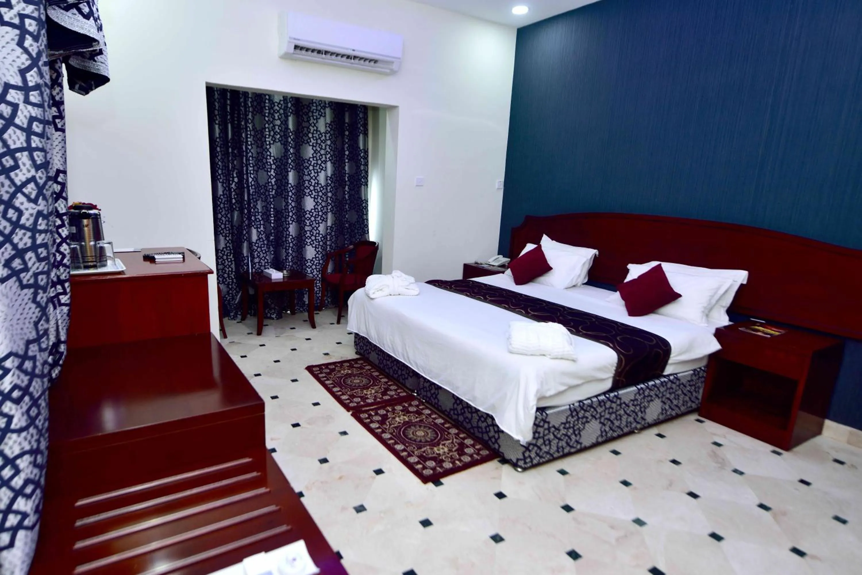 Photo of the whole room, Bed in Al Bahjah Hotel