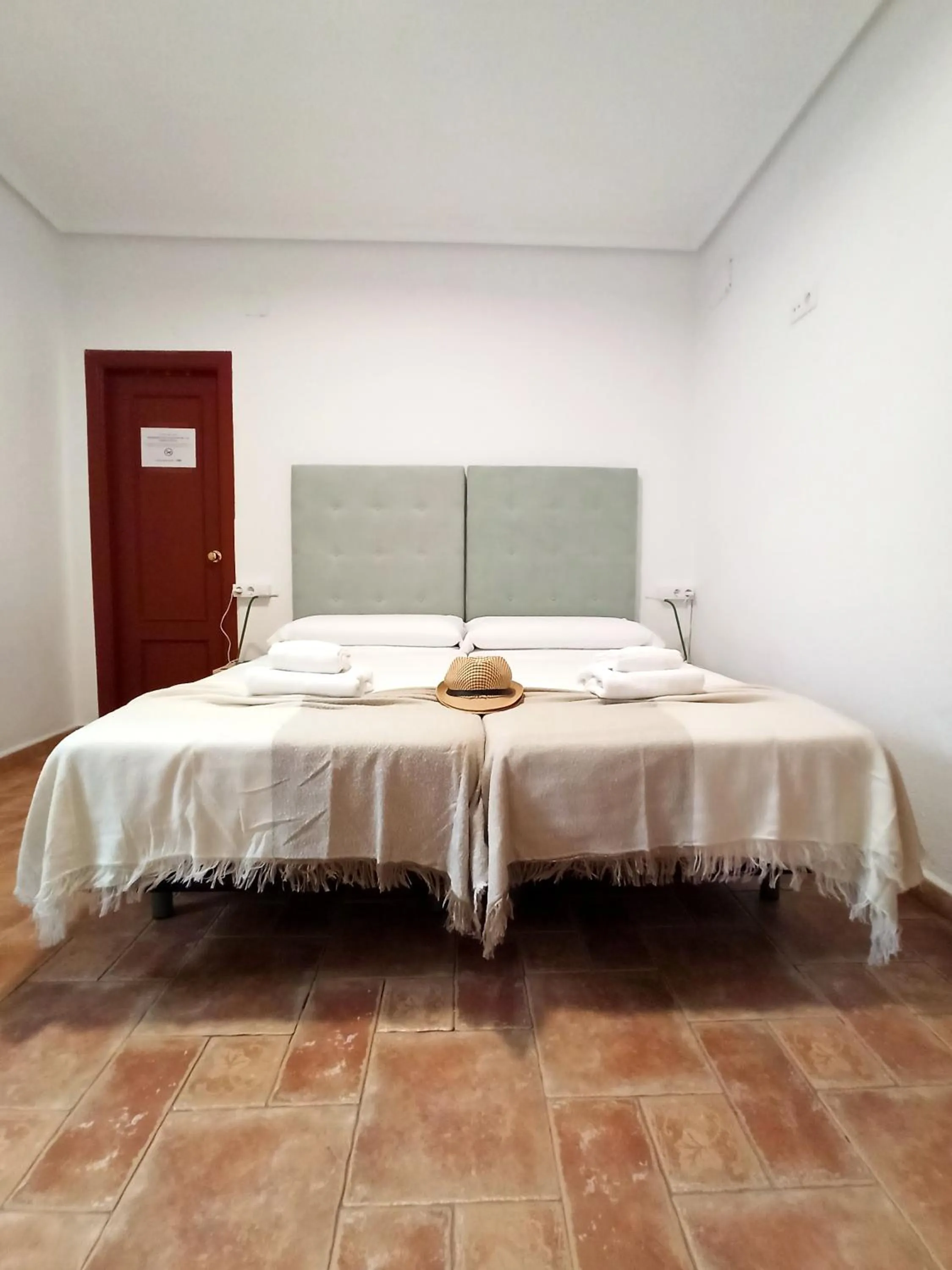 Bed in Vivian's Guest House Auto Check-in