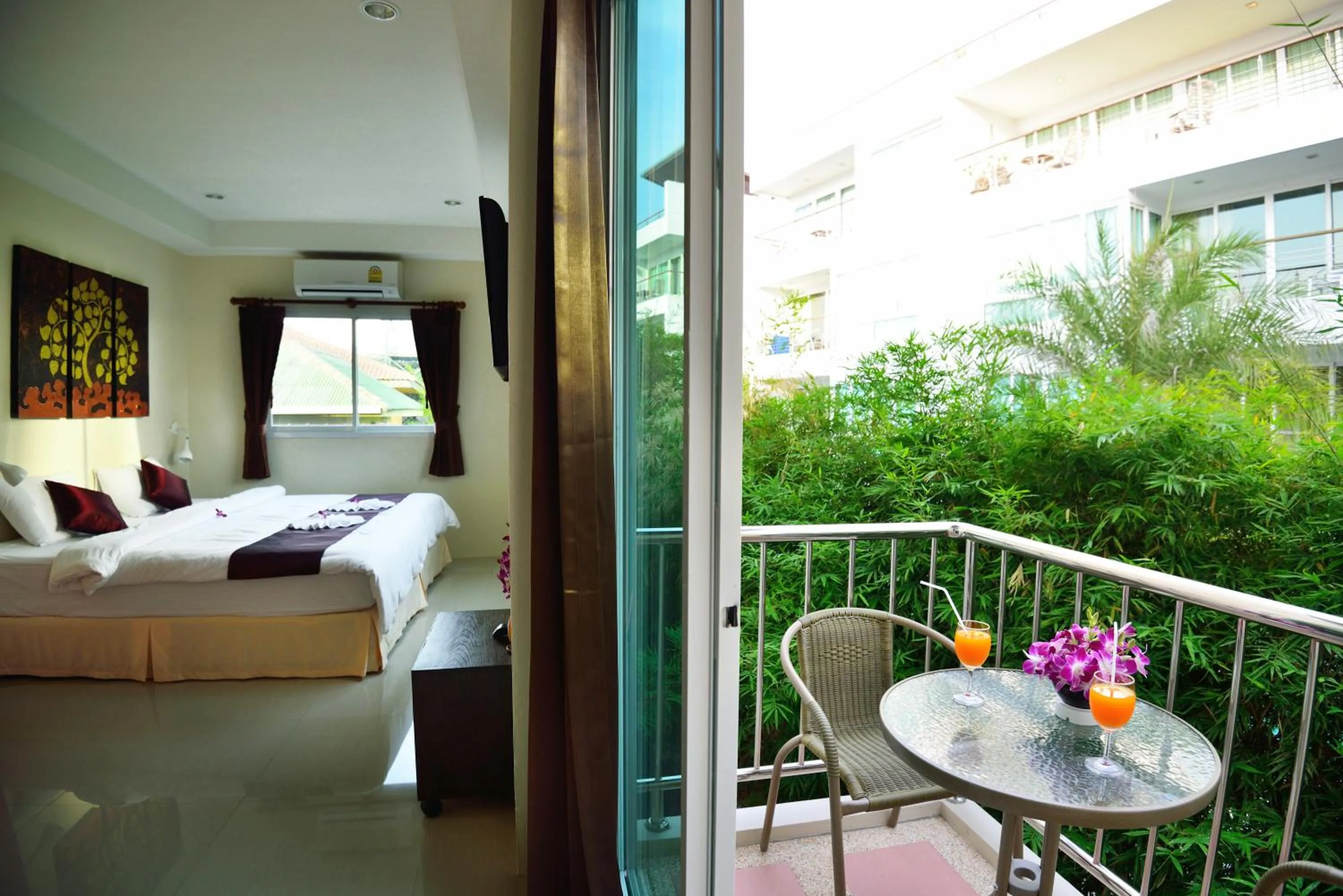 Balcony/Terrace, Bed in At Kamala Hotel