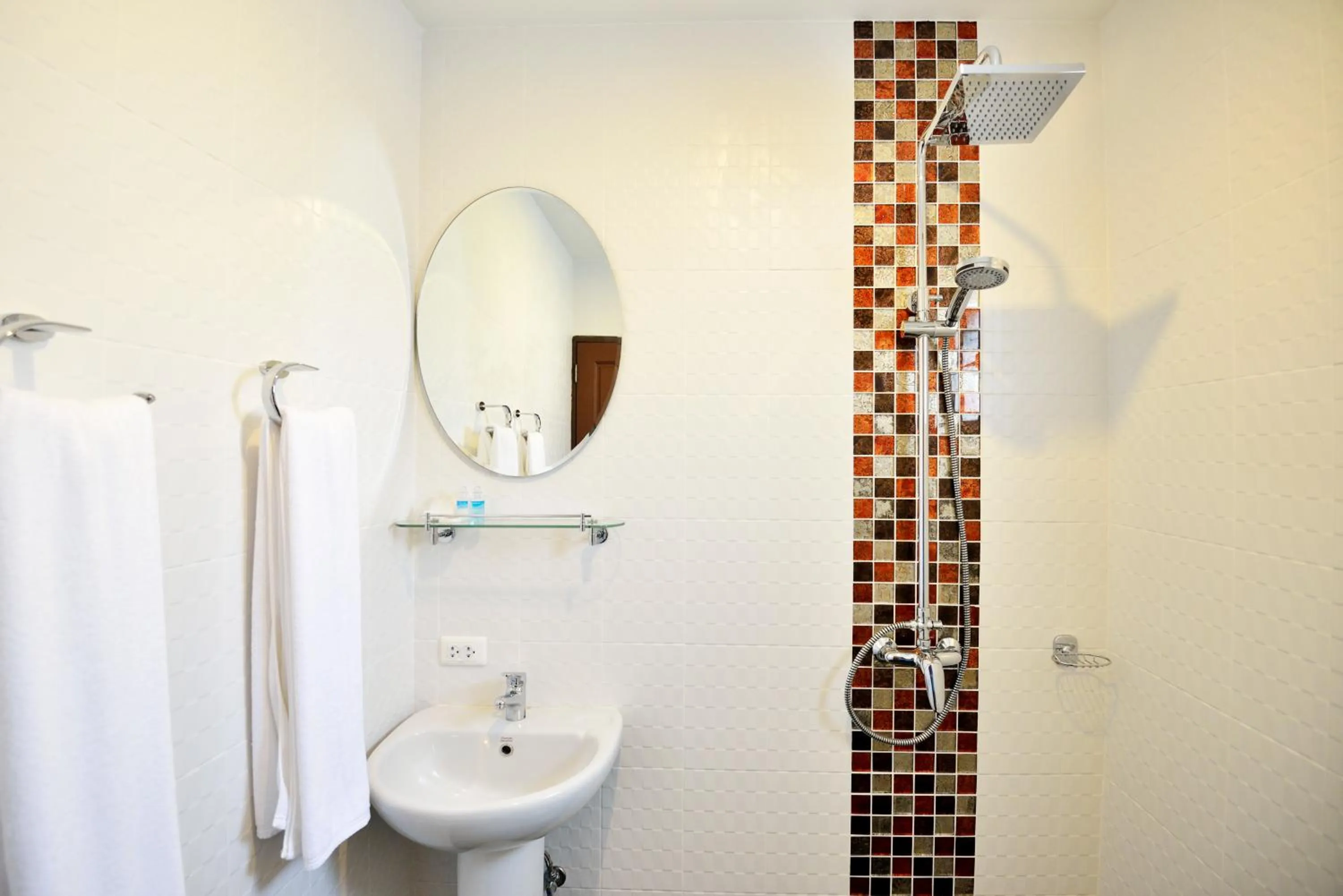 Bathroom in At Kamala Hotel