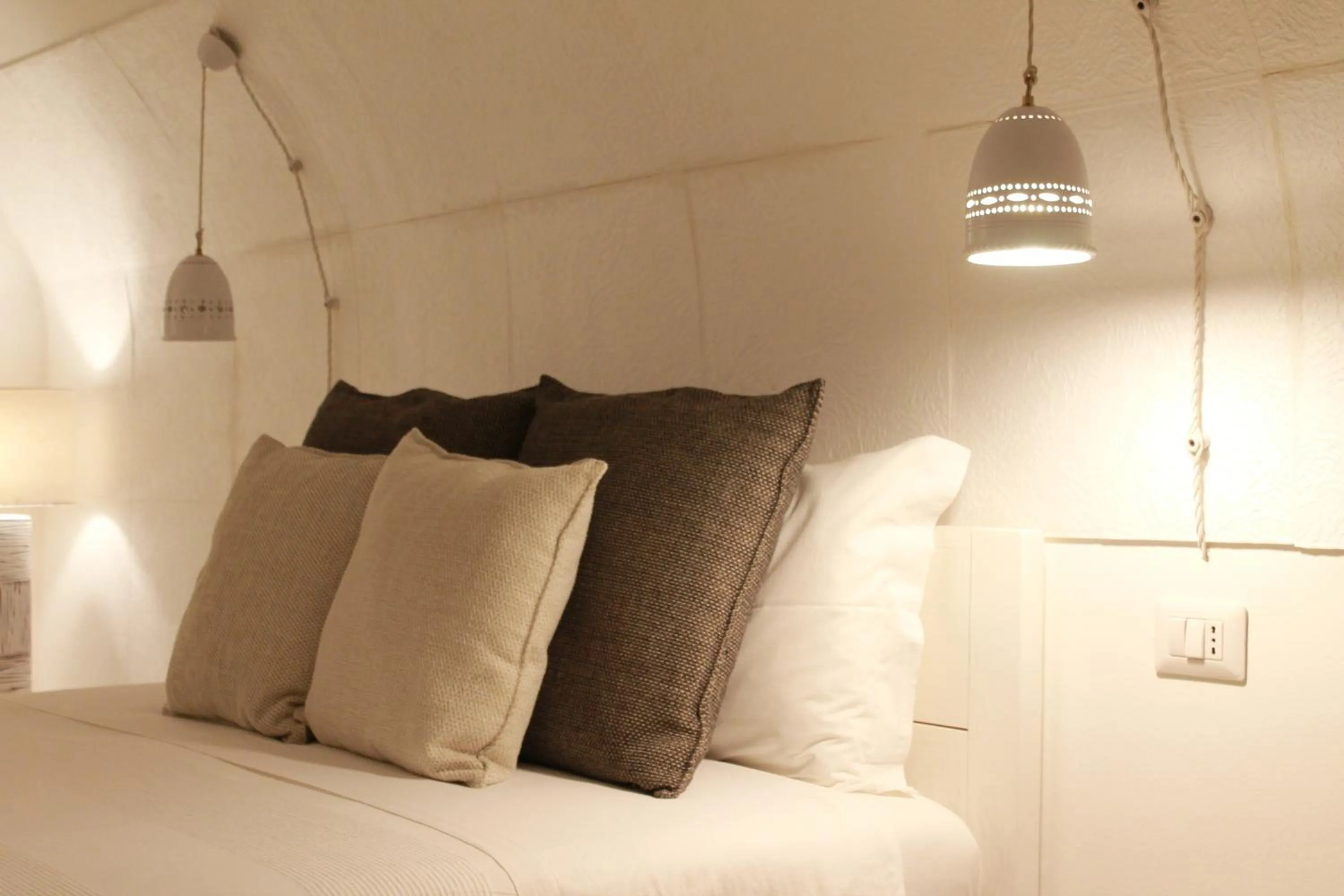 Bed in Palmieri Luxury Rooms