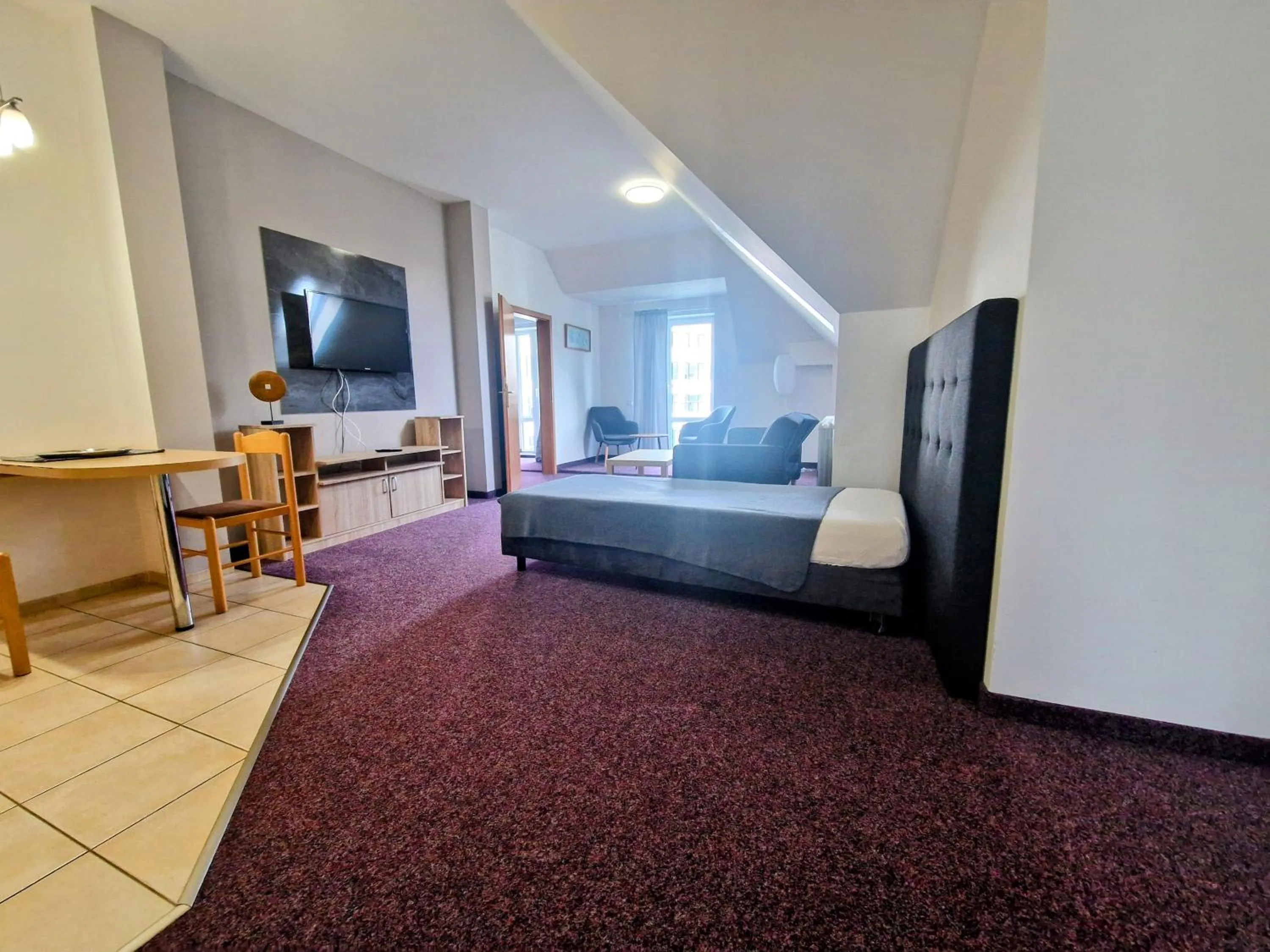 Bed in Family hotel Maxim