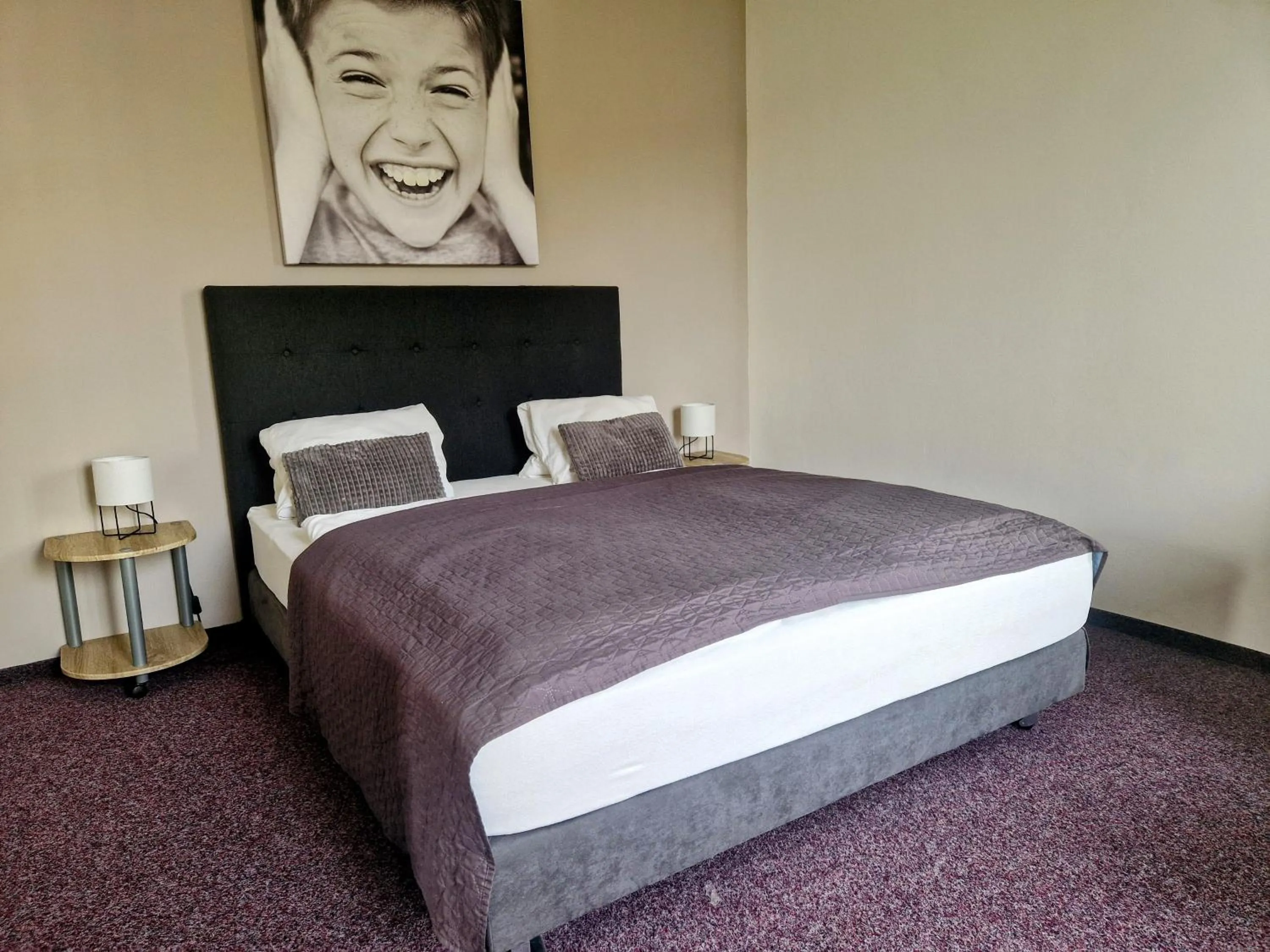 Bed in Family hotel Maxim