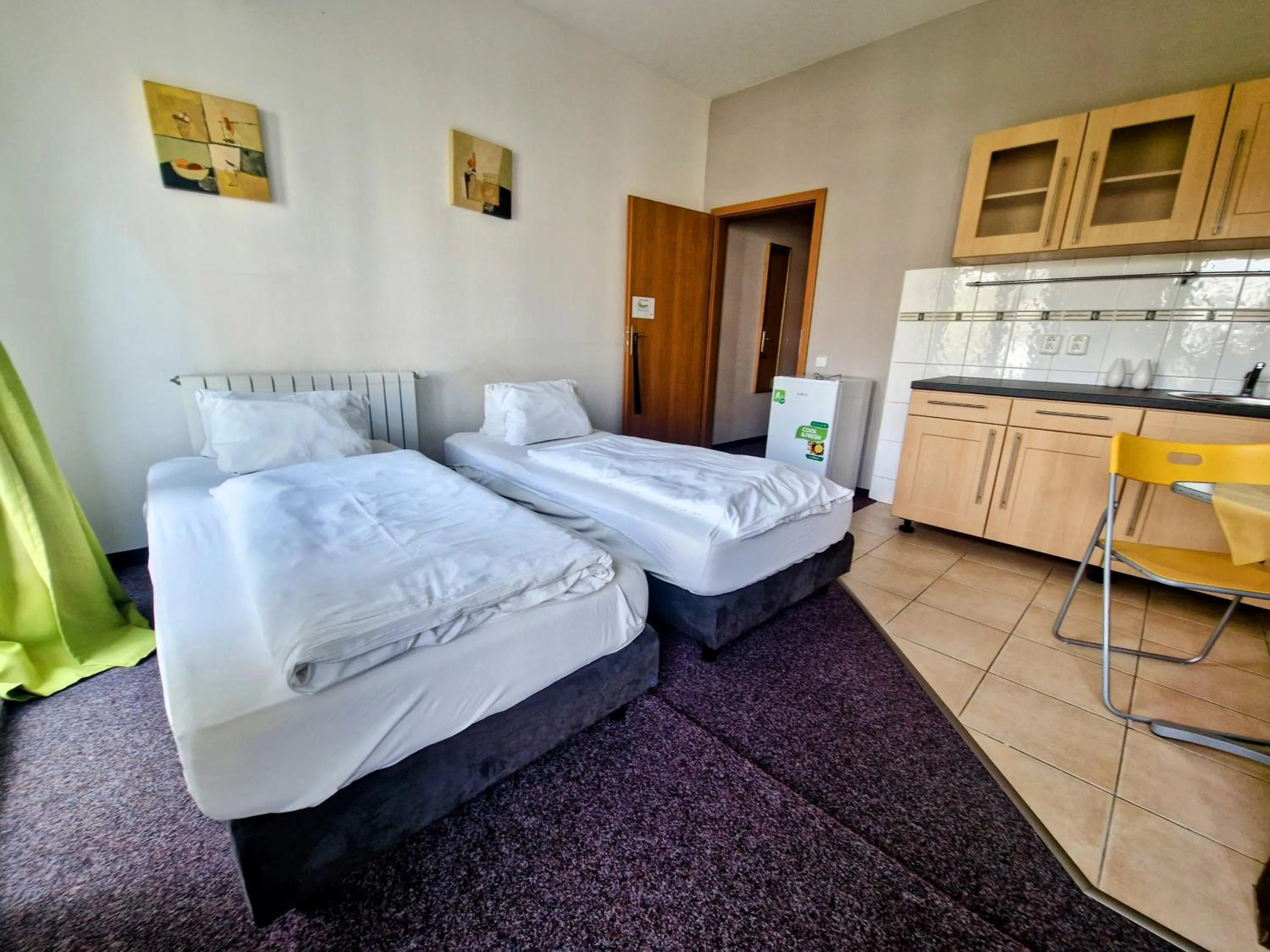 Bed in Family hotel Maxim